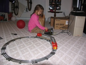 SamPopTrain Sam with her great-grandfather's trains