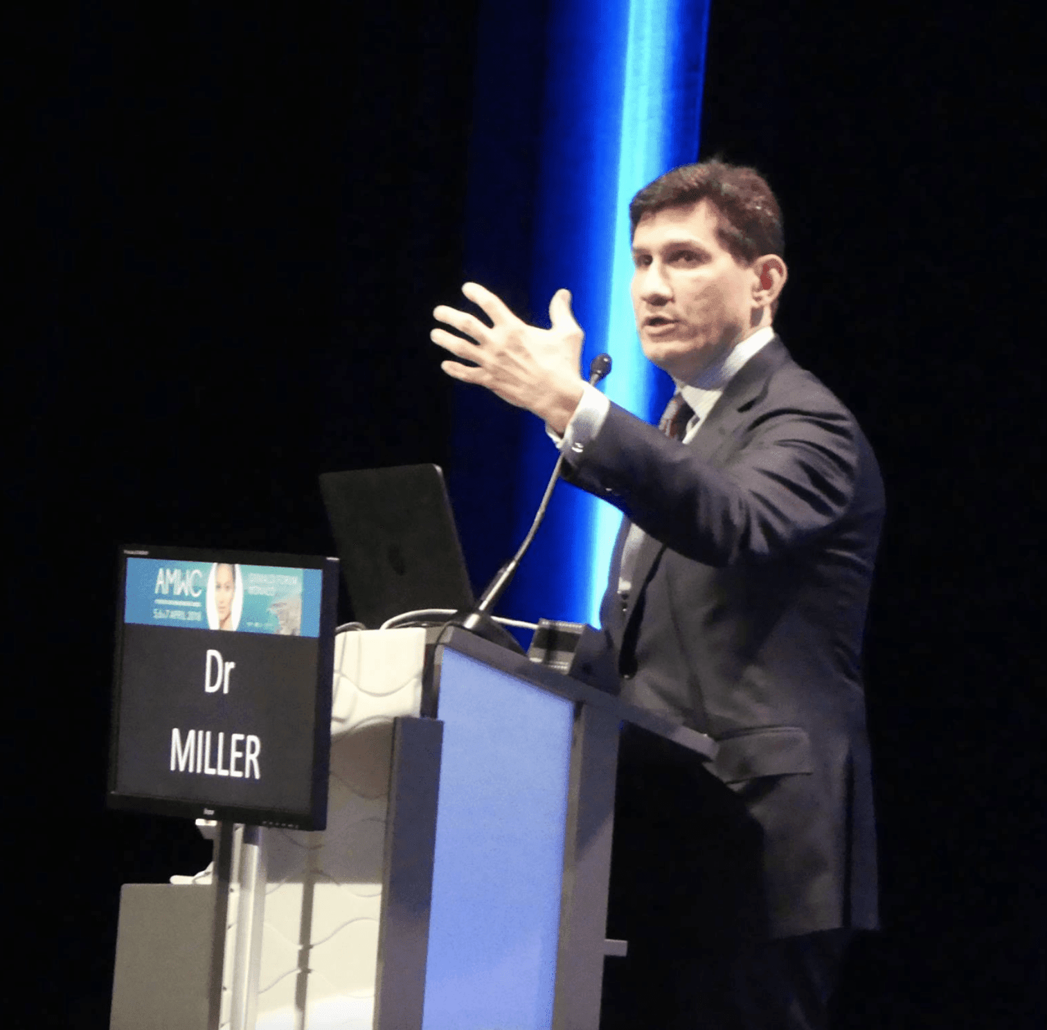 Dr. Miller speaking at an event