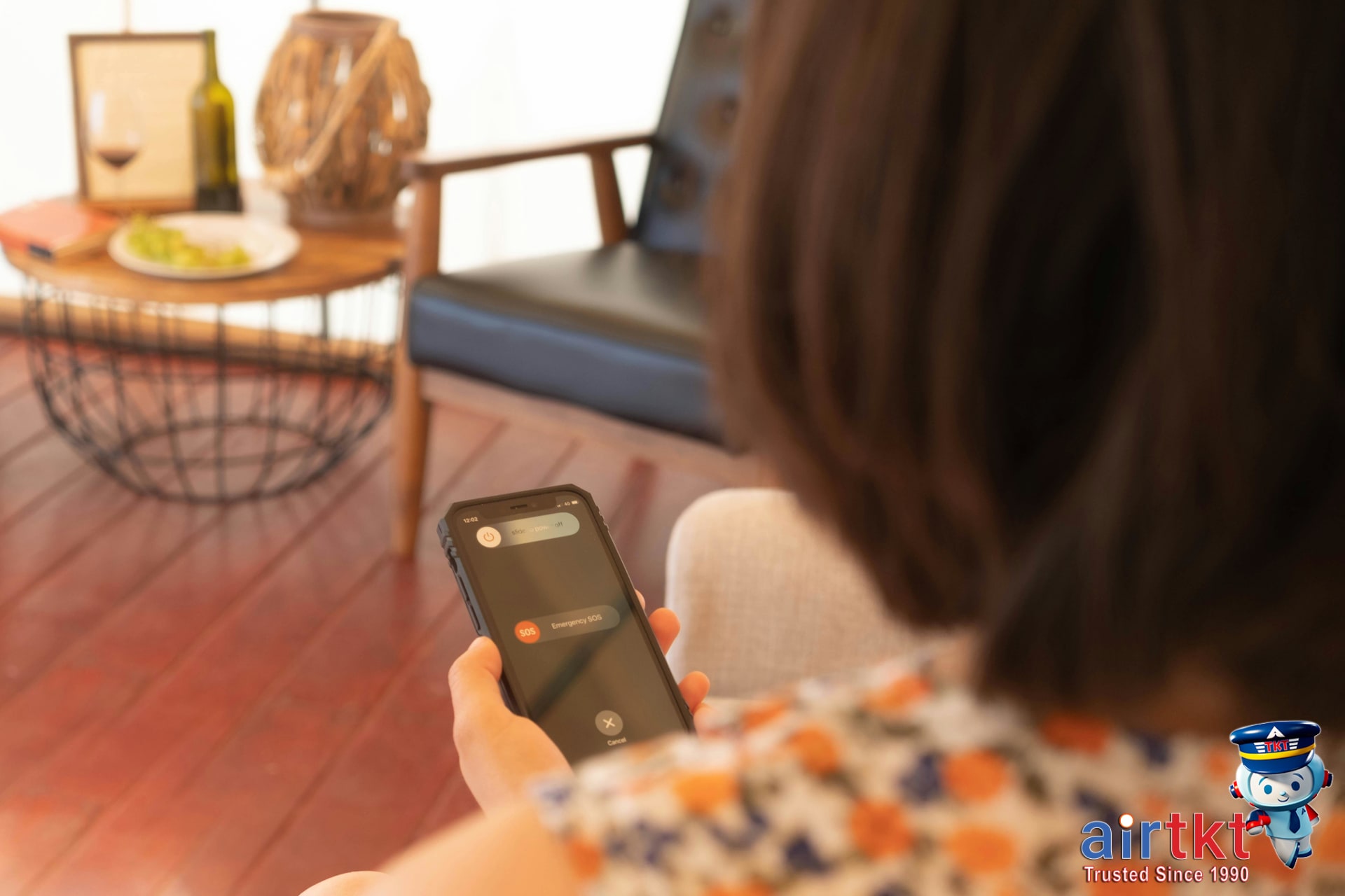 Person using smartphone for emergency alerts