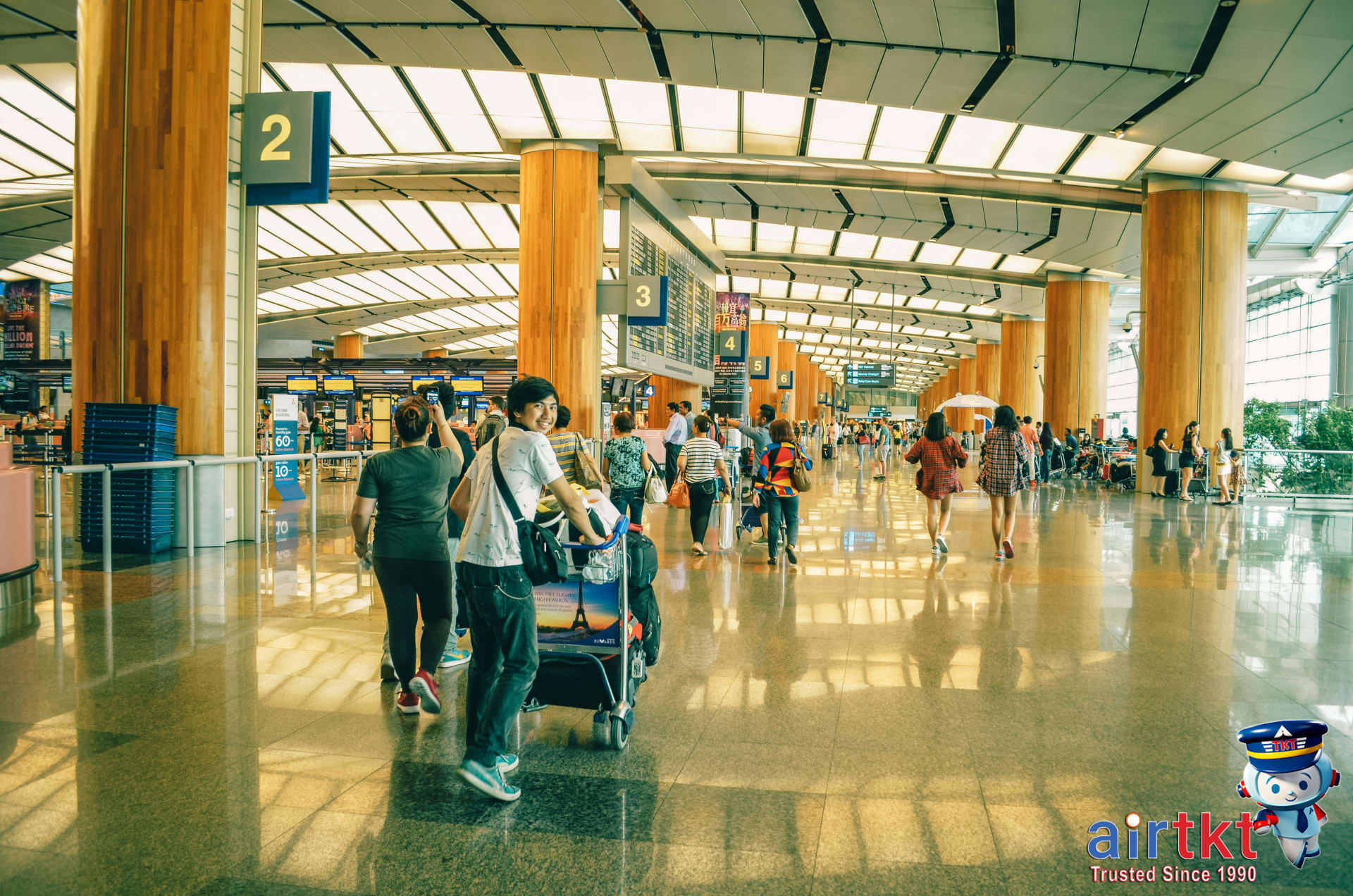 Airplane flying over Pacific Ocean at sunset