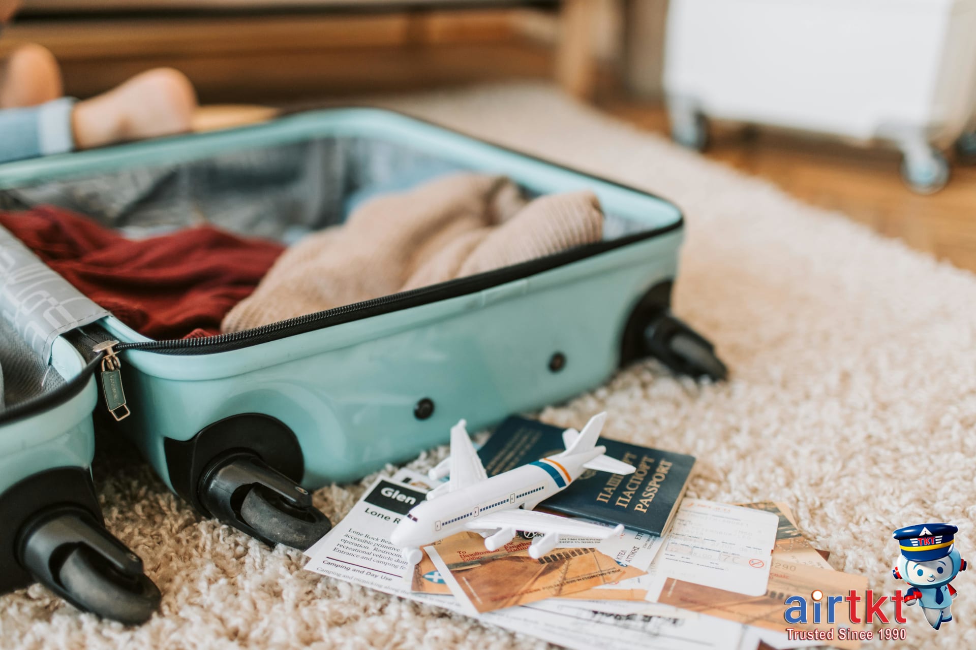 Traveler packing suitcase and preparing documents for travel safety