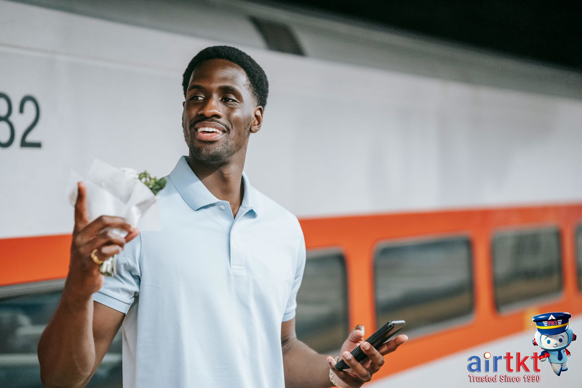 Airplane flying over medium-altitude landscape with sunset