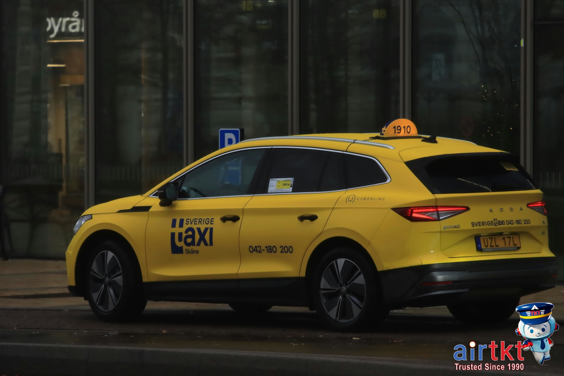Traveler checking taxi license and meter