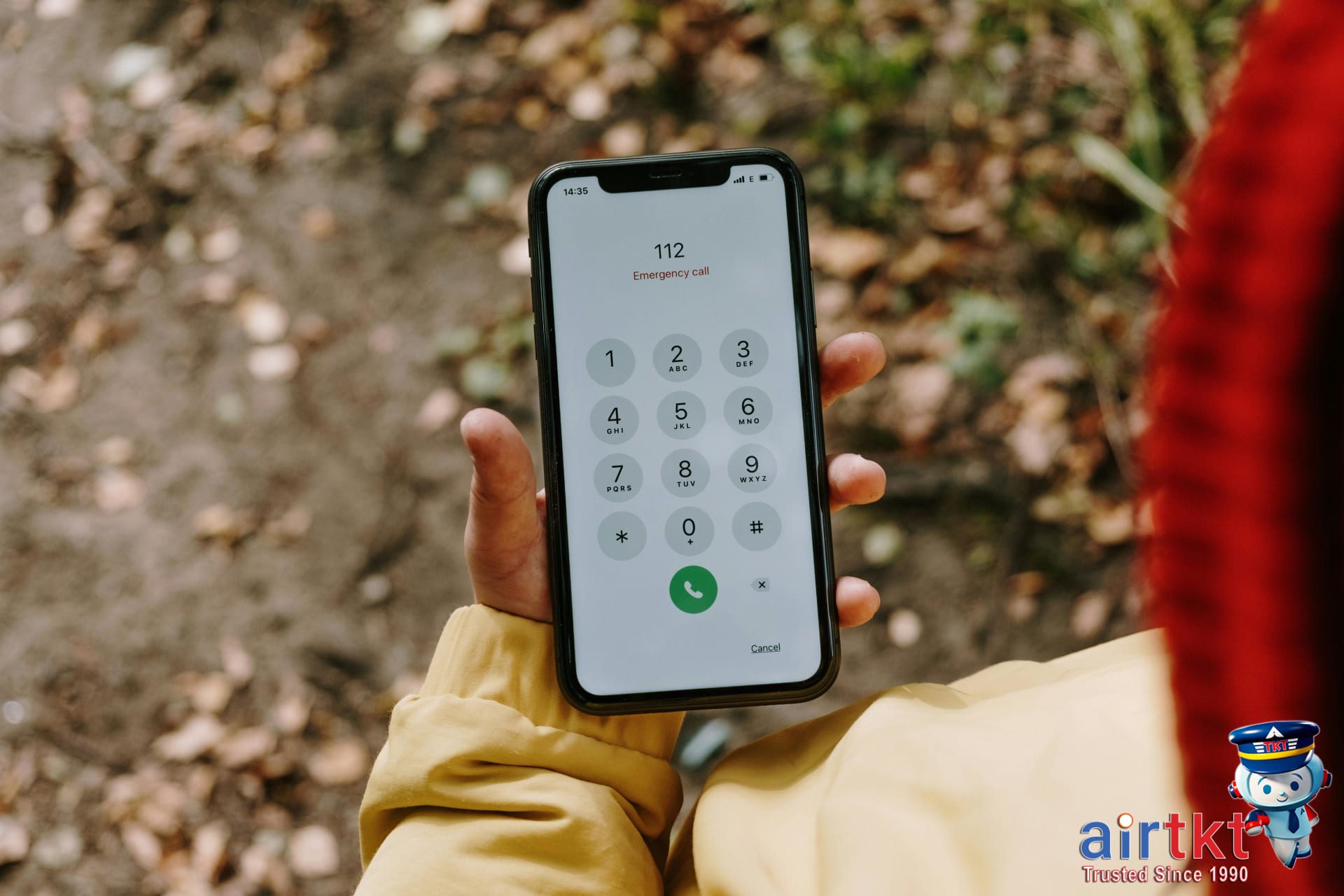 Traveler on phone checking emergency contacts