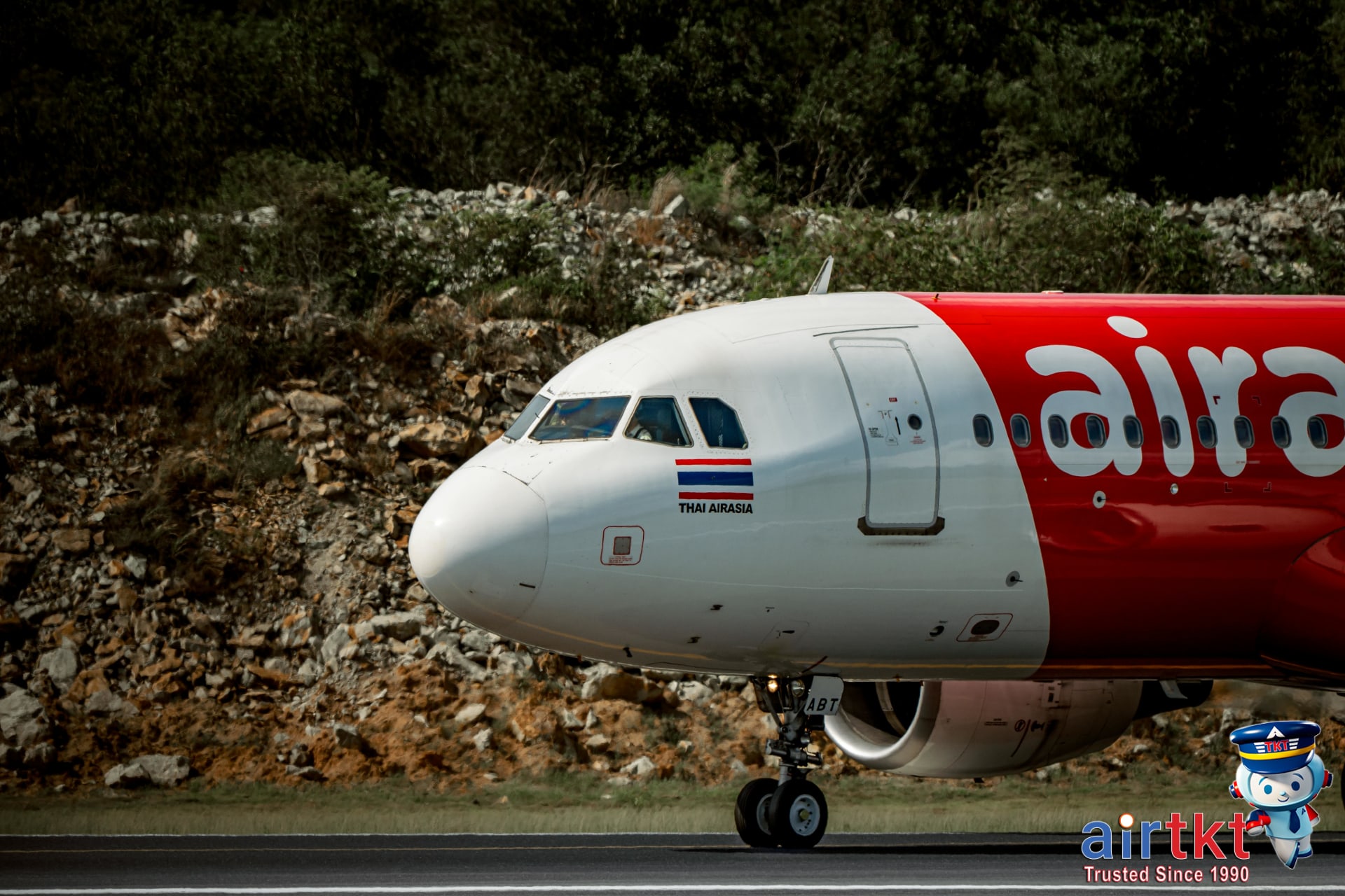Thai AirAsia Airbus airplane landing on runway close up