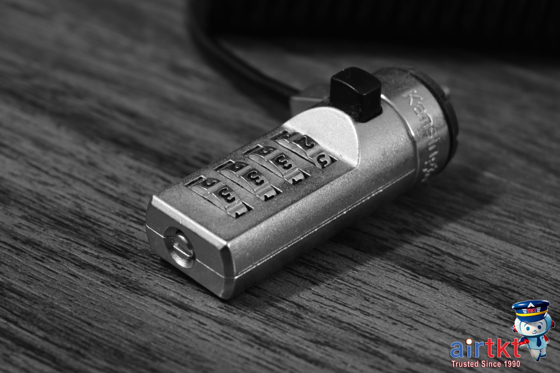 Traveler securing luggage lock at airport