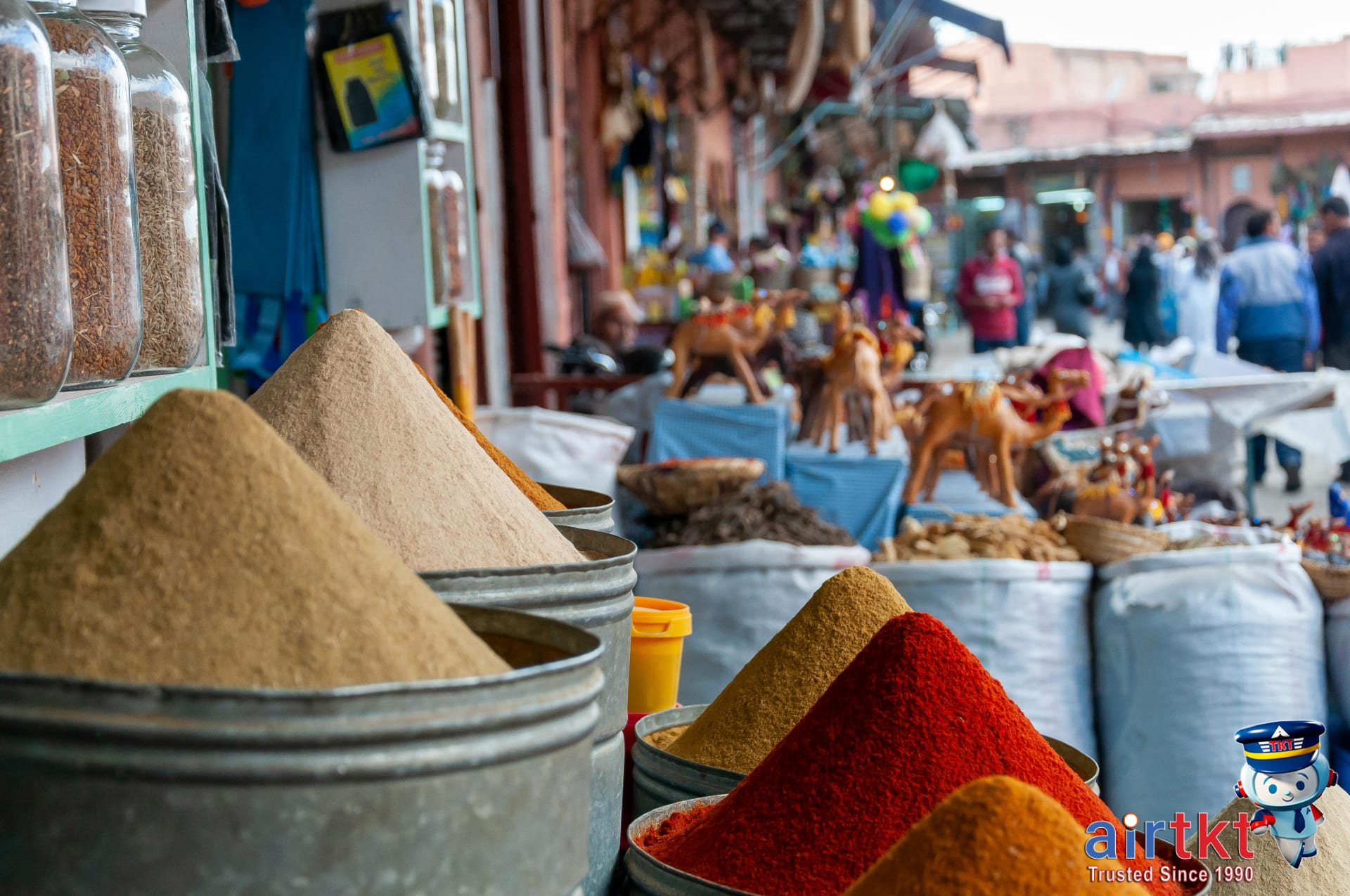 Marrakech souk market stalls with local shoppers