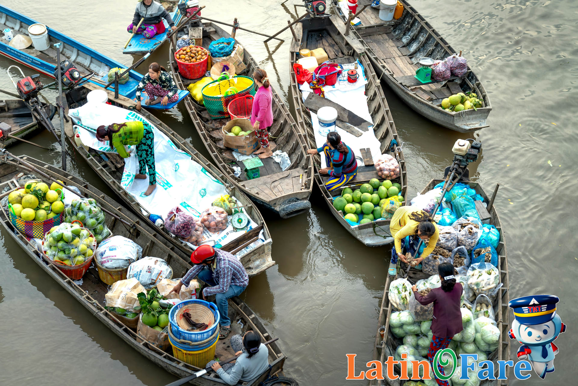 Boats at a Bangkok floating market with vendors and colorful produce