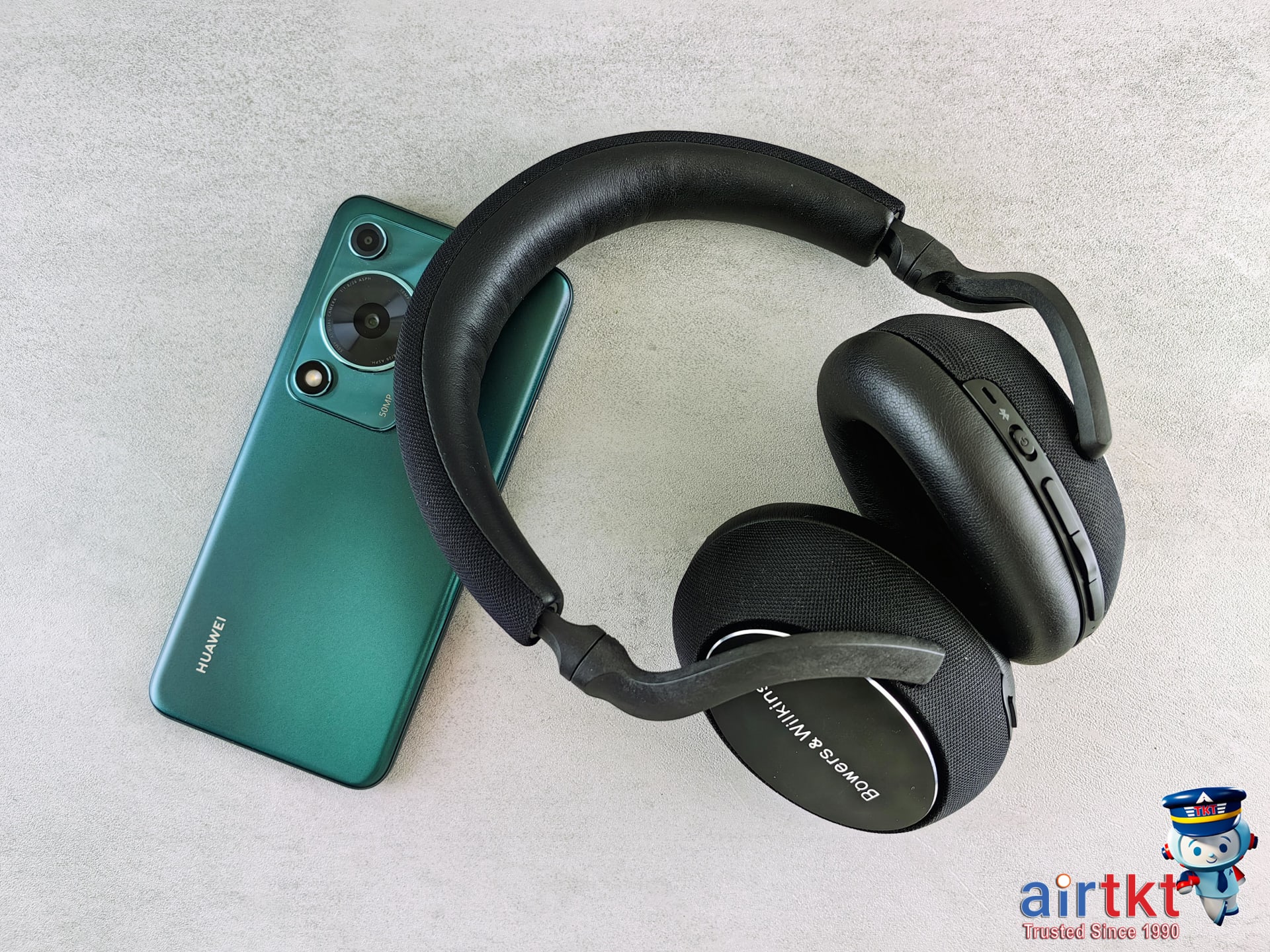 Bose and Sony headphones on travel setup