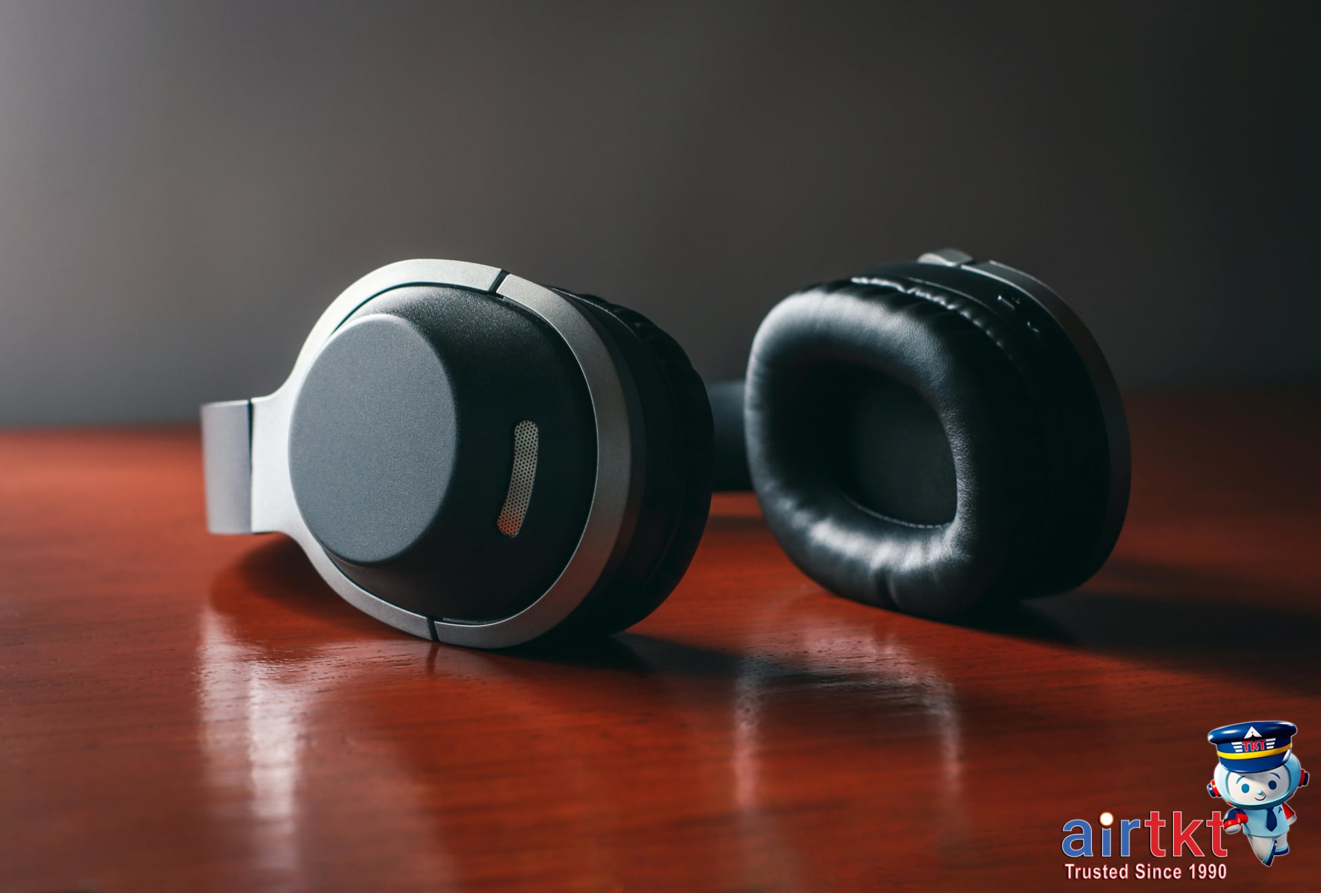 Traveler using noise-canceling headphones on a plane