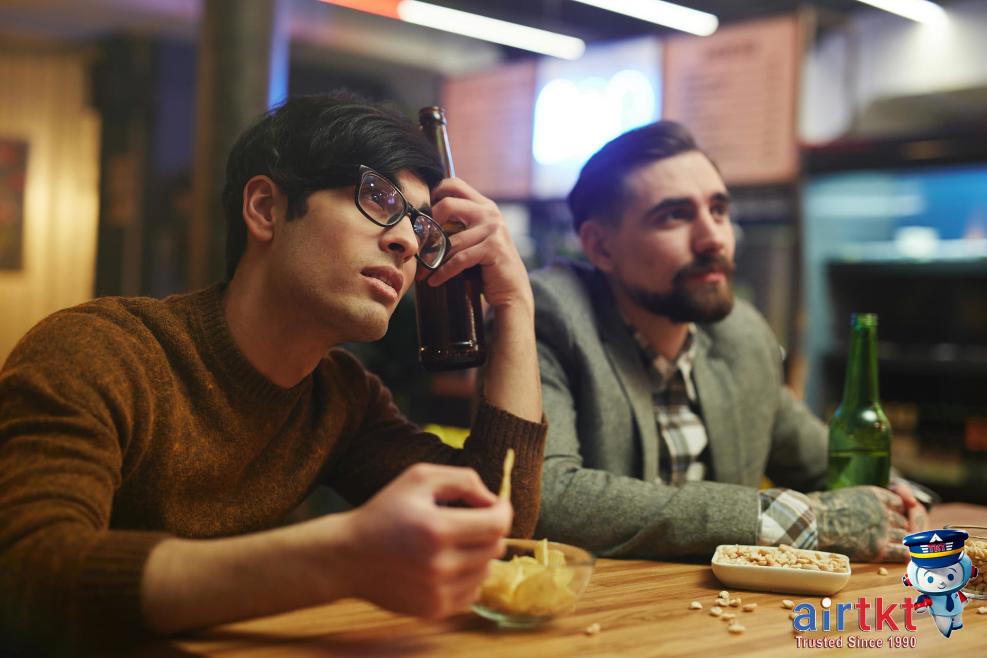 Crowd watching NCAA tournament game in public fan zone