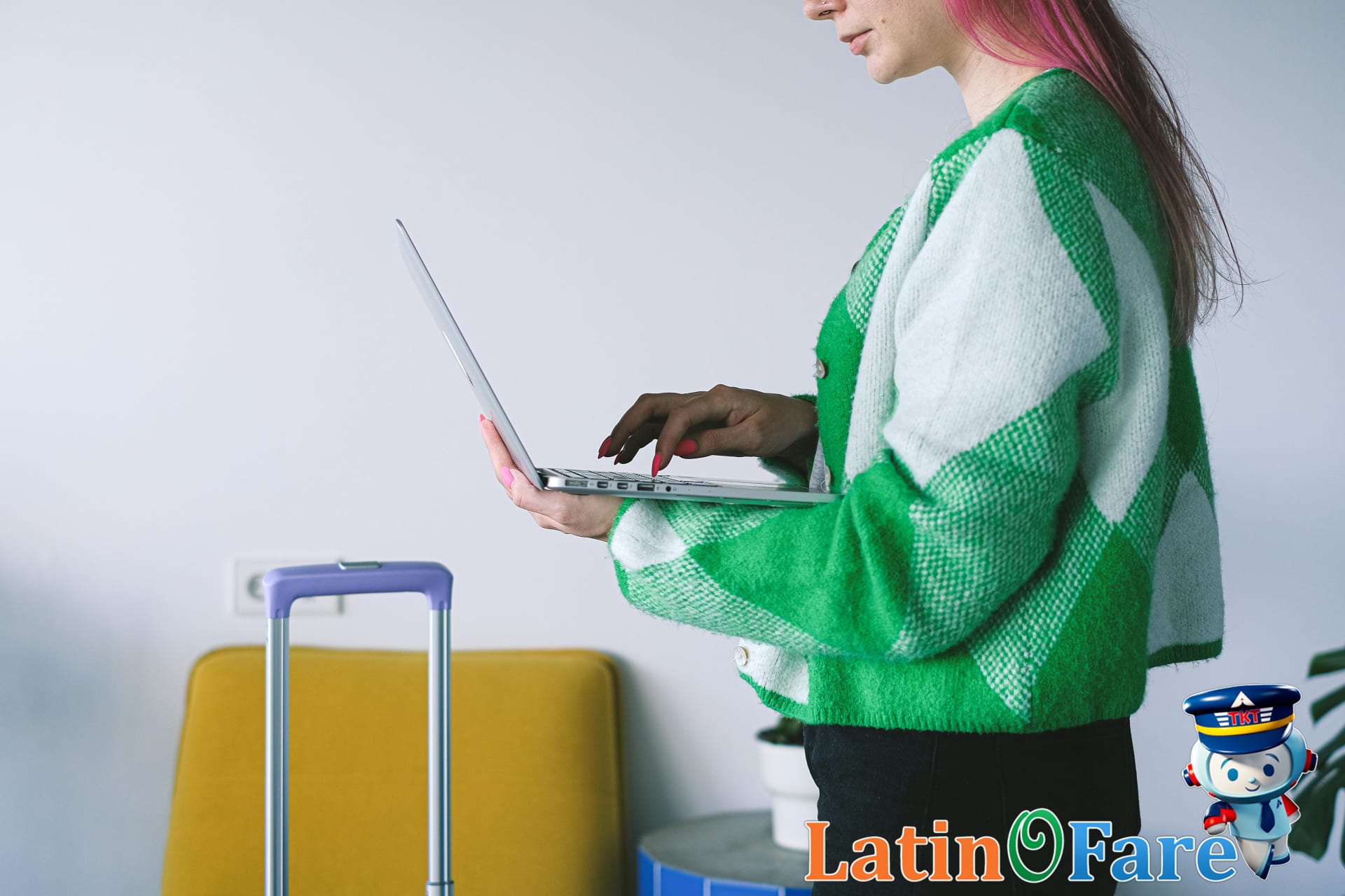 Traveler comparing last-minute hotel deals on laptop in hotel lounge for better pricing