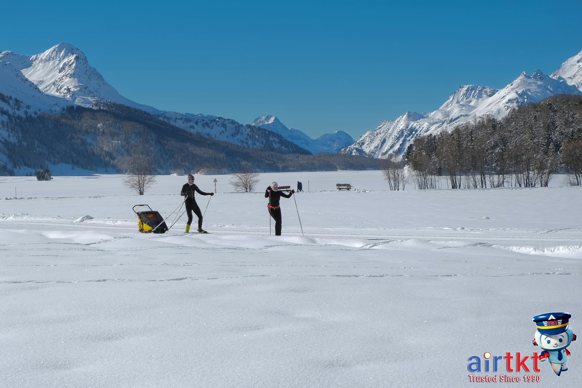Family skiing together enjoying winter sports on snowy Alps slopes