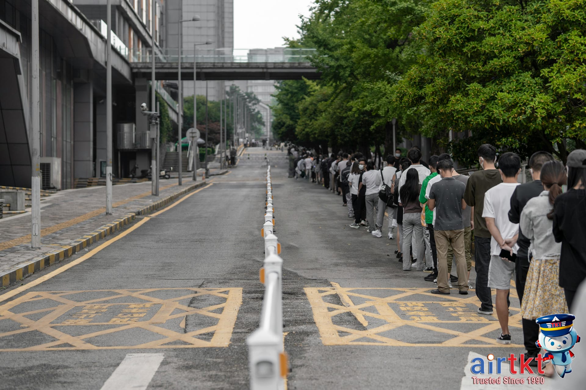 Typical Canadian social etiquette like polite people queuing outdoors in orderly fashion
