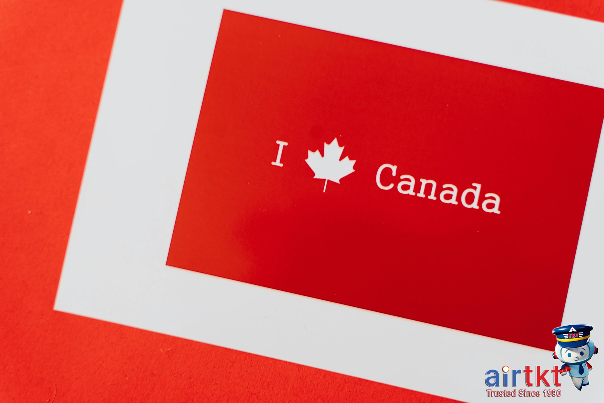 Canadian flag with bilingual greetings in red and white colors symbolizing Canadian customs