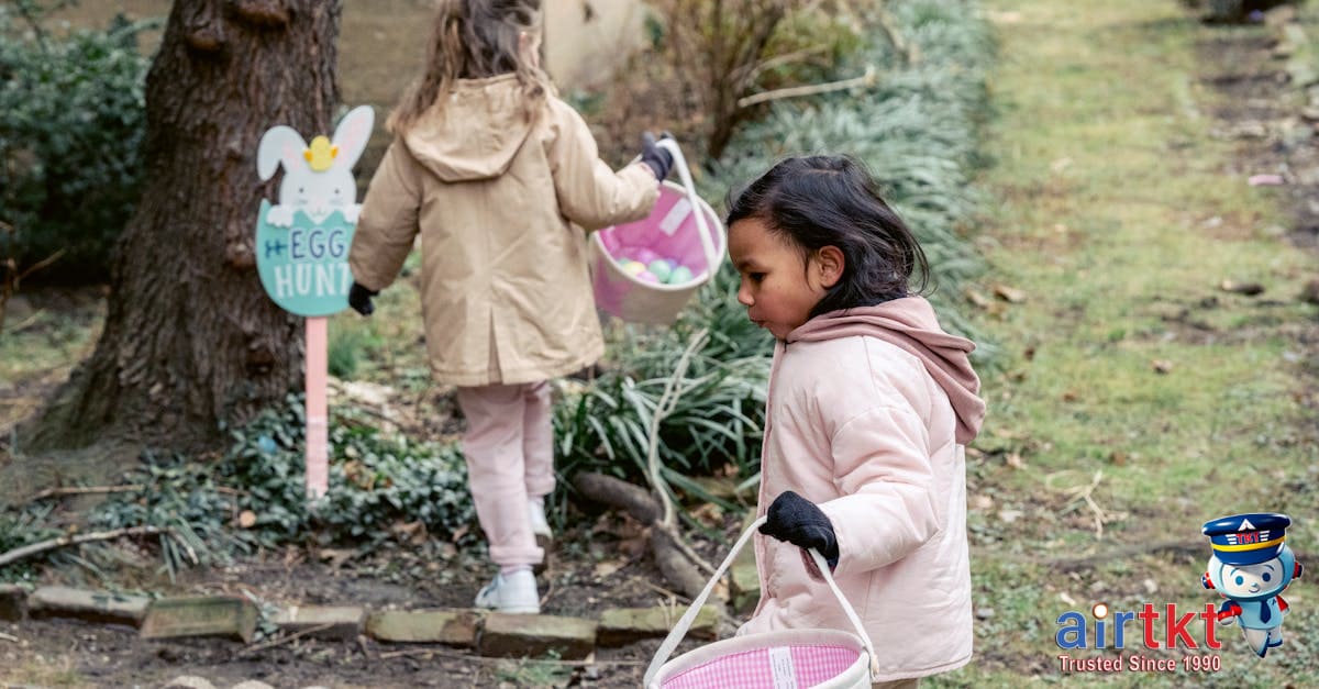 Families enjoying Easter egg hunt in flowering spring garden