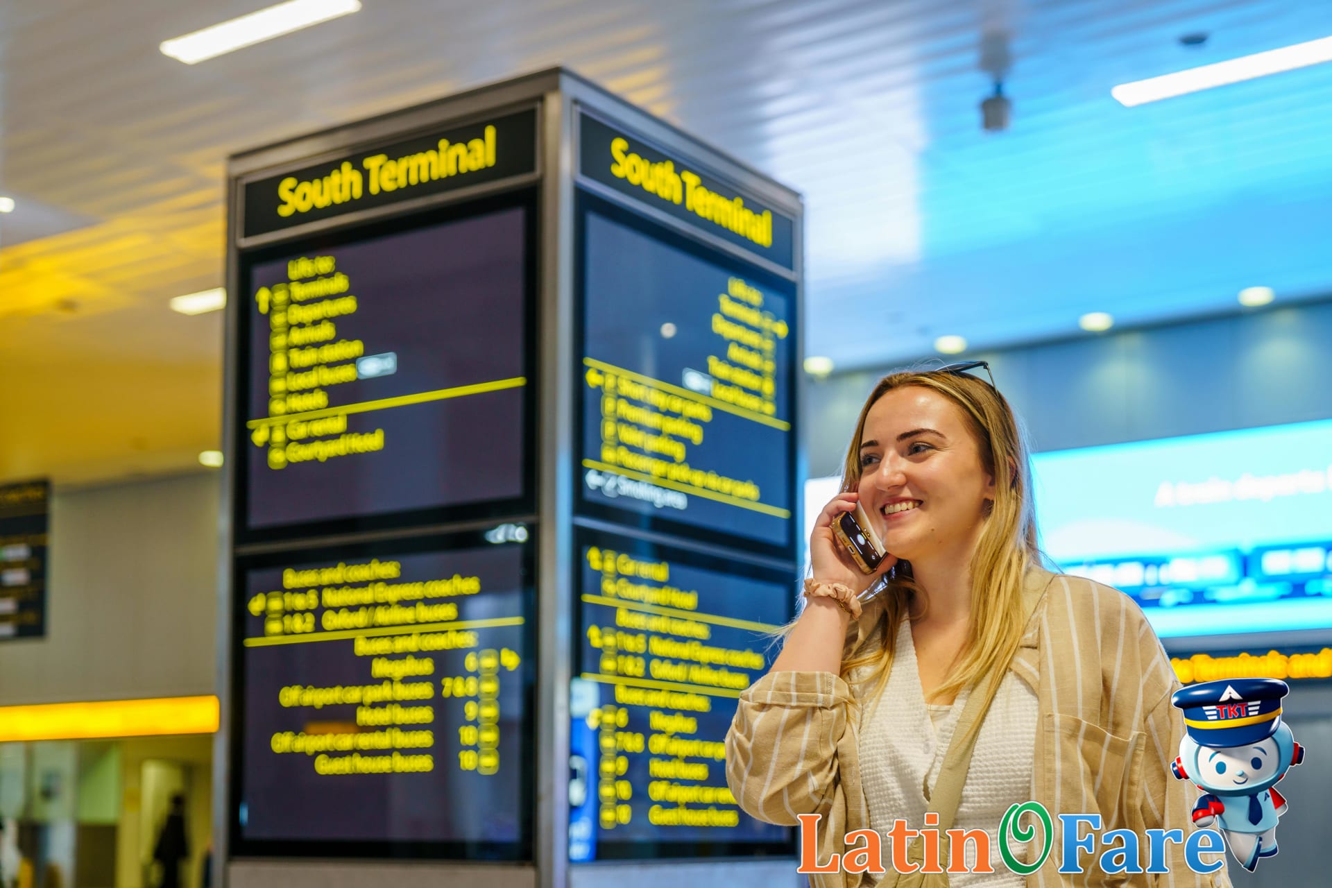 Traveler at airport arrivals using smartphone for international roaming tips