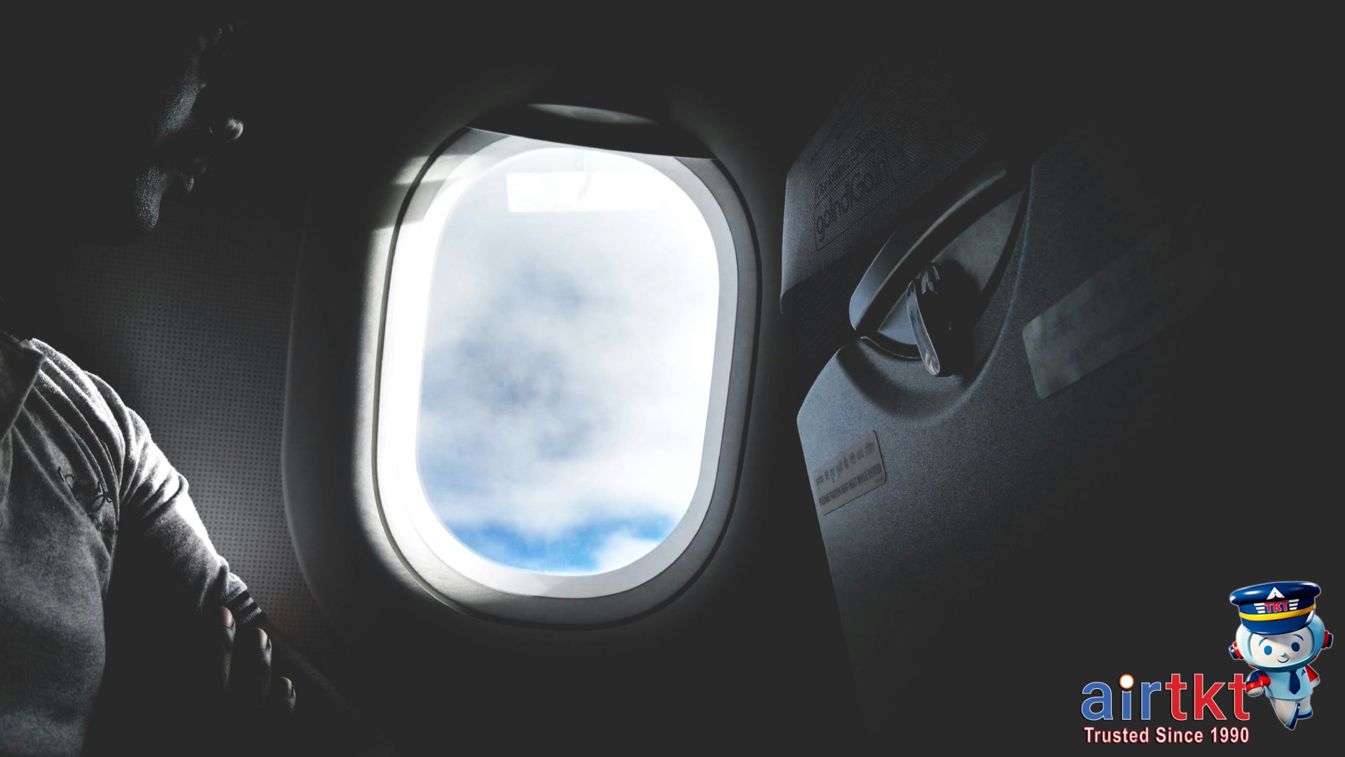 Passengers on a transcontinental US flight enjoying comfortable airline seats and window views