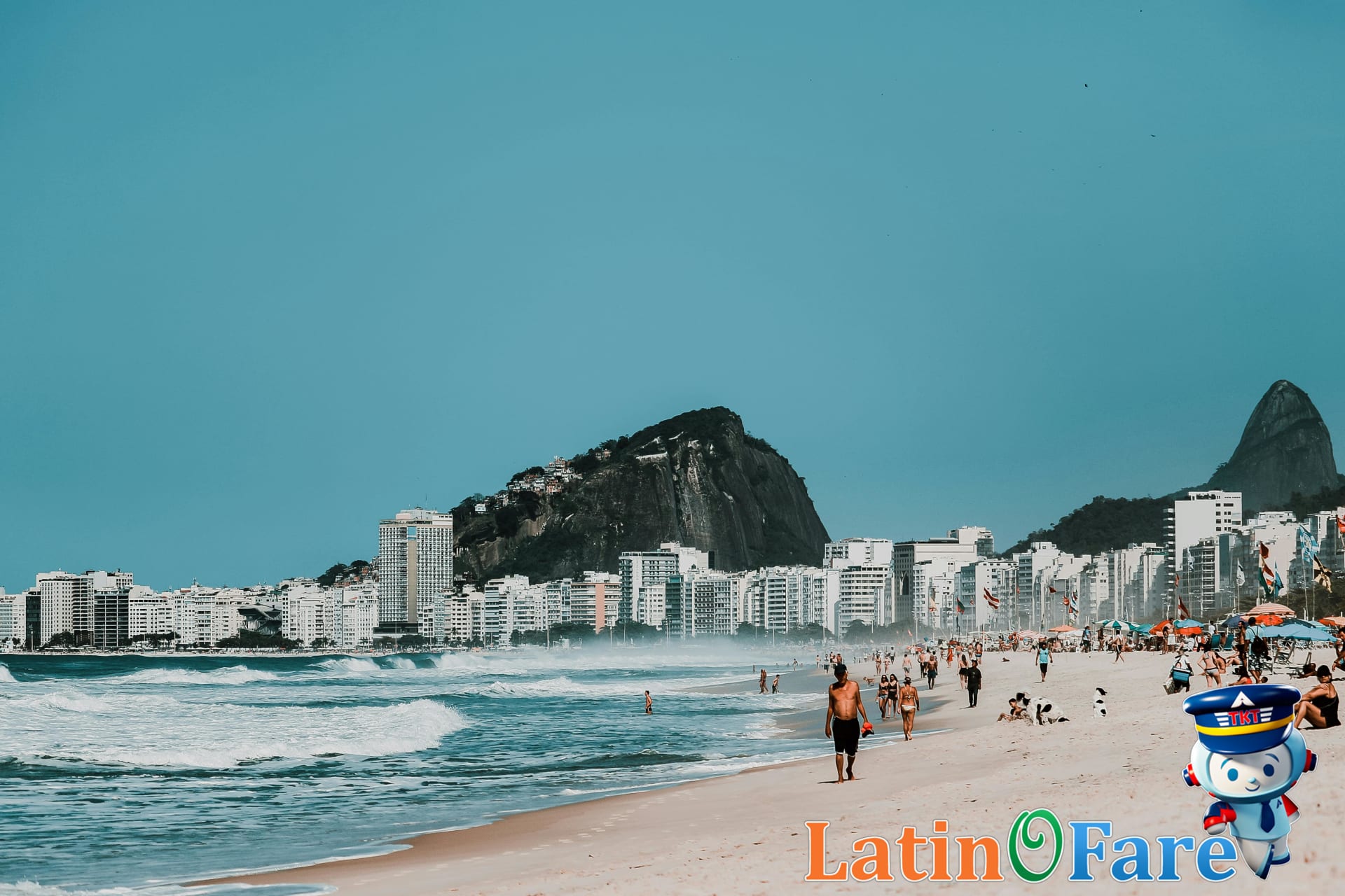 Wide Copacabana Beach with umbrellas, Rio de Janeiro beaches for first-time visitors