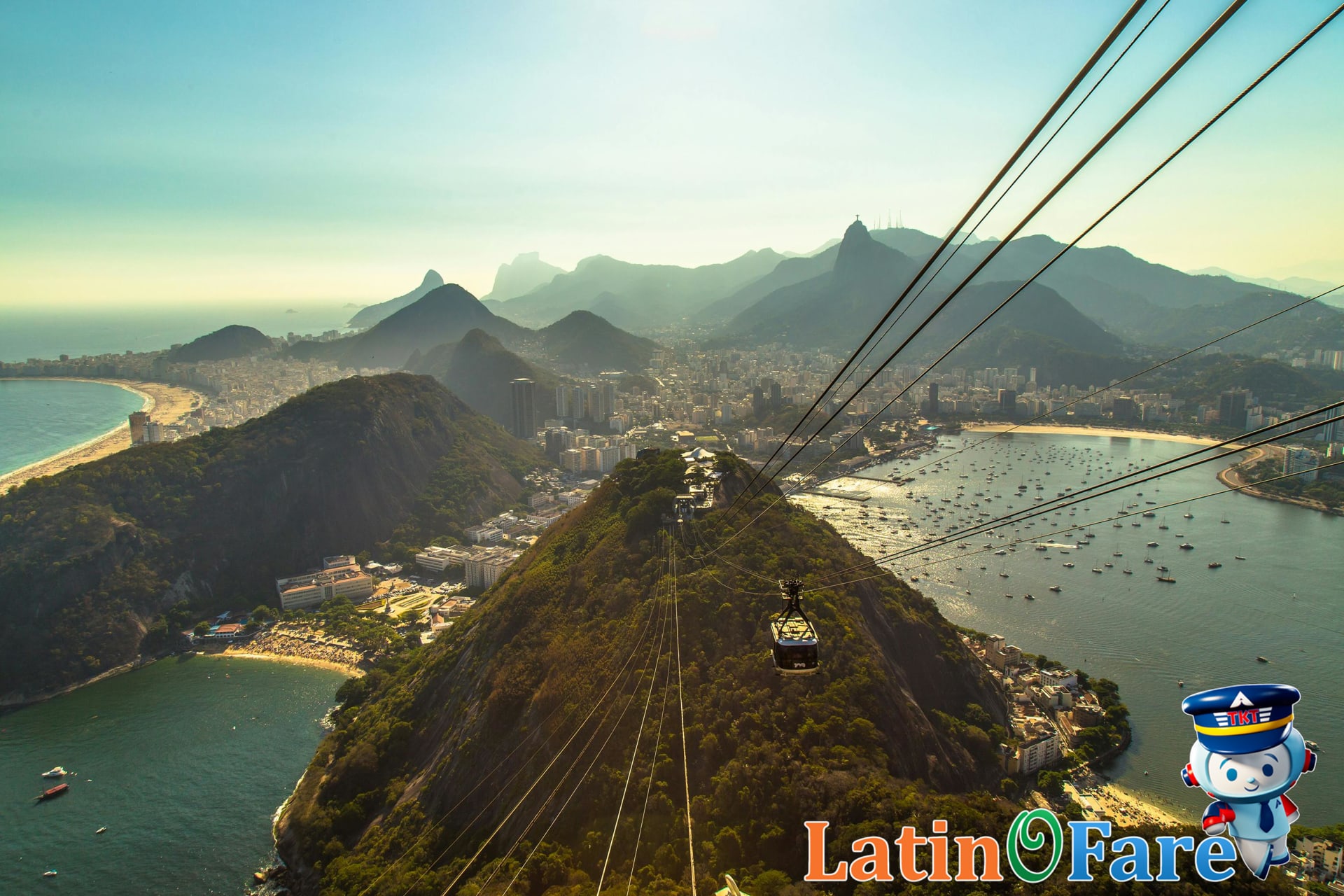 Panoramic cable car view showing Sugarloaf Mountain and Rio cityscape for new visitors