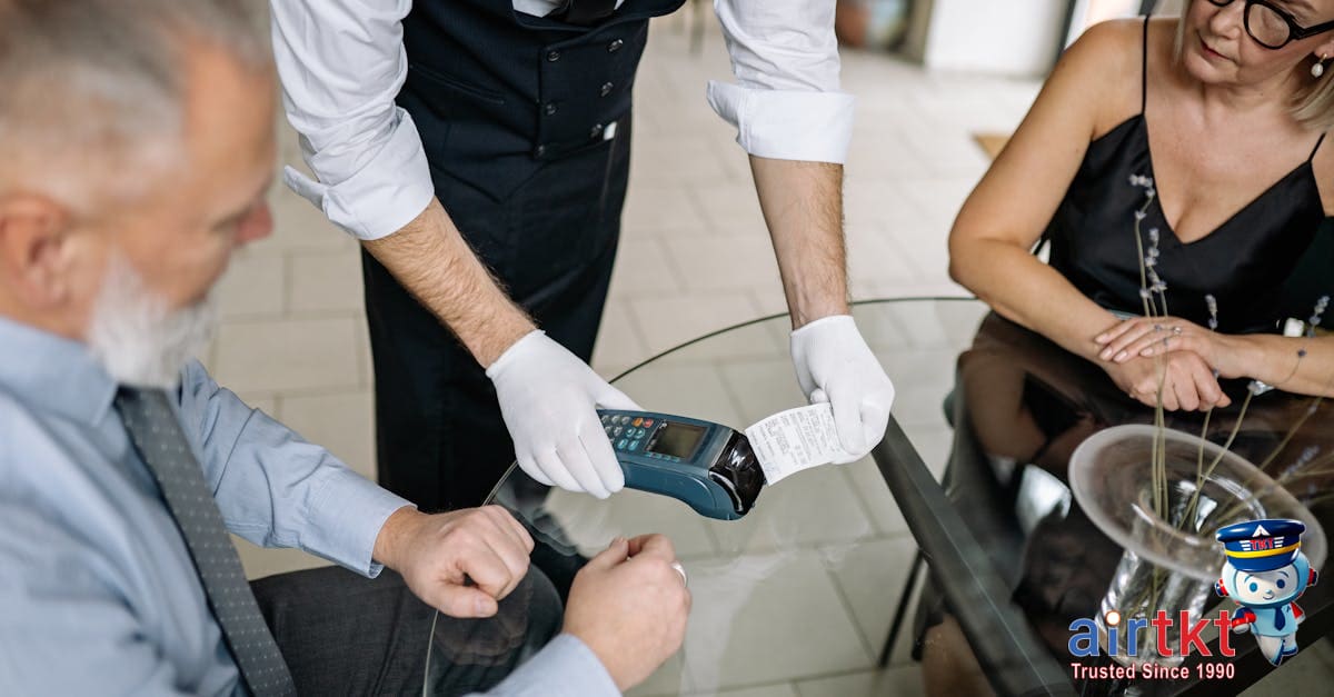 A couple making card payment using credit card in a foreign restaurant