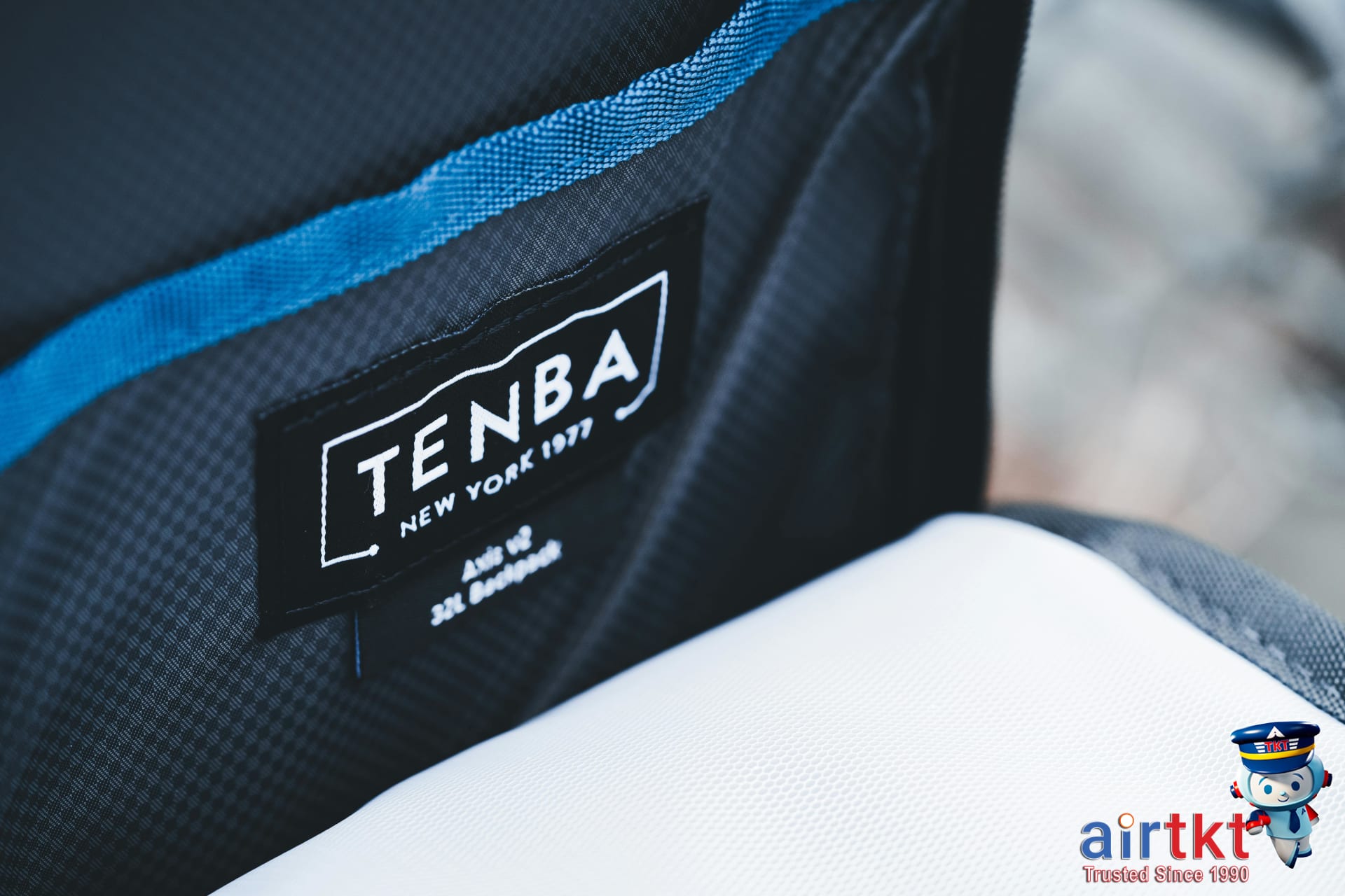 Traveler placing wallet and phone in hidden jacket pocket for travel safety