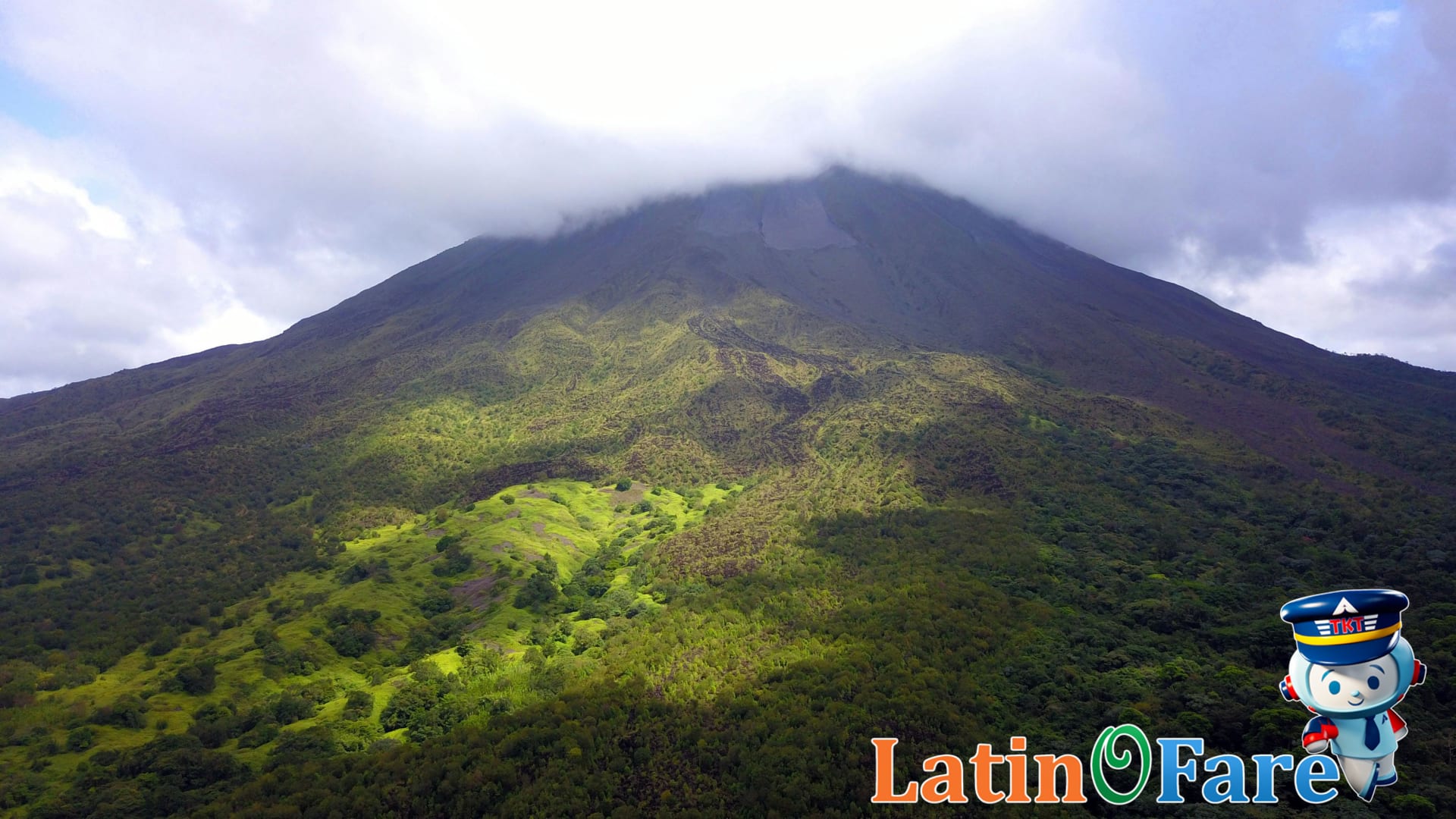Misty Arenal volcano showing typical Costa Rica green season climate with afternoon showers.