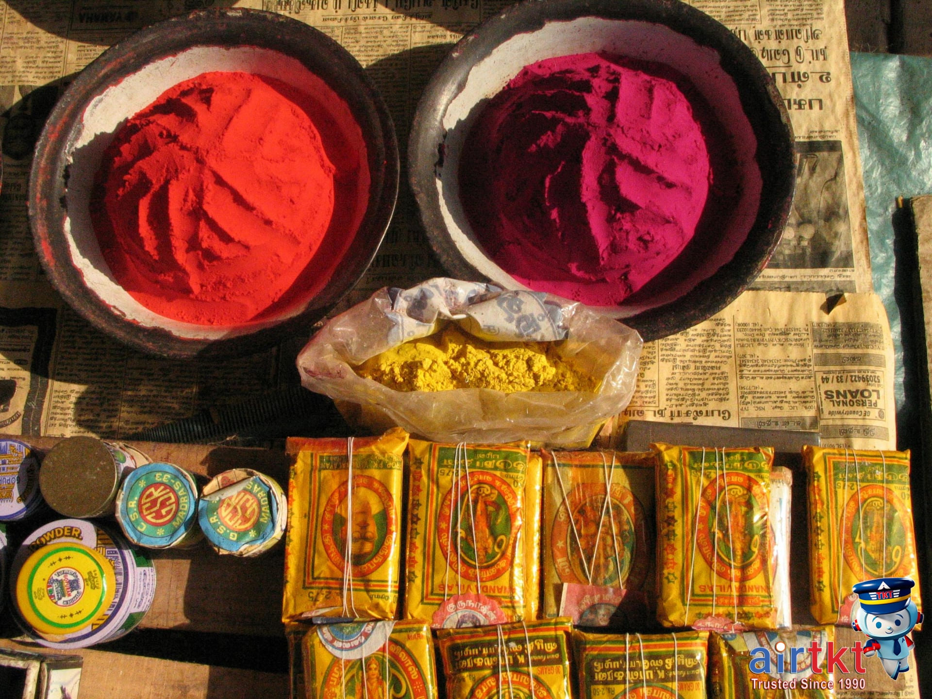 Brightly colored Holi powders and water balloons at Indian market