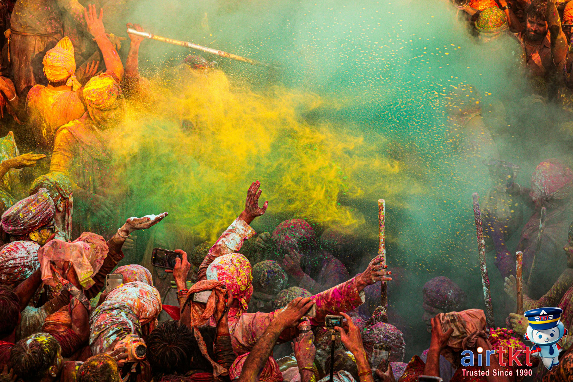 Colorful Holi festival crowd celebrating in Mathura, India