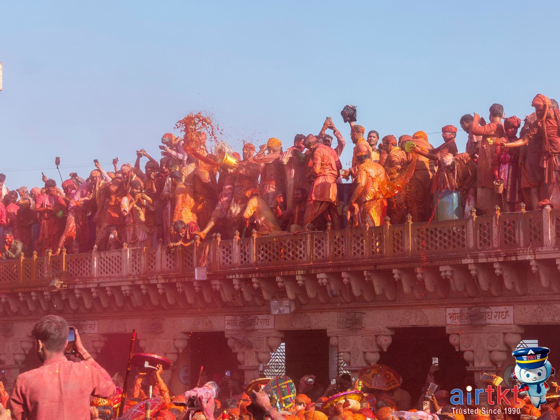 Crowds enjoying colorful Holi festival at Nandgaon temple, India