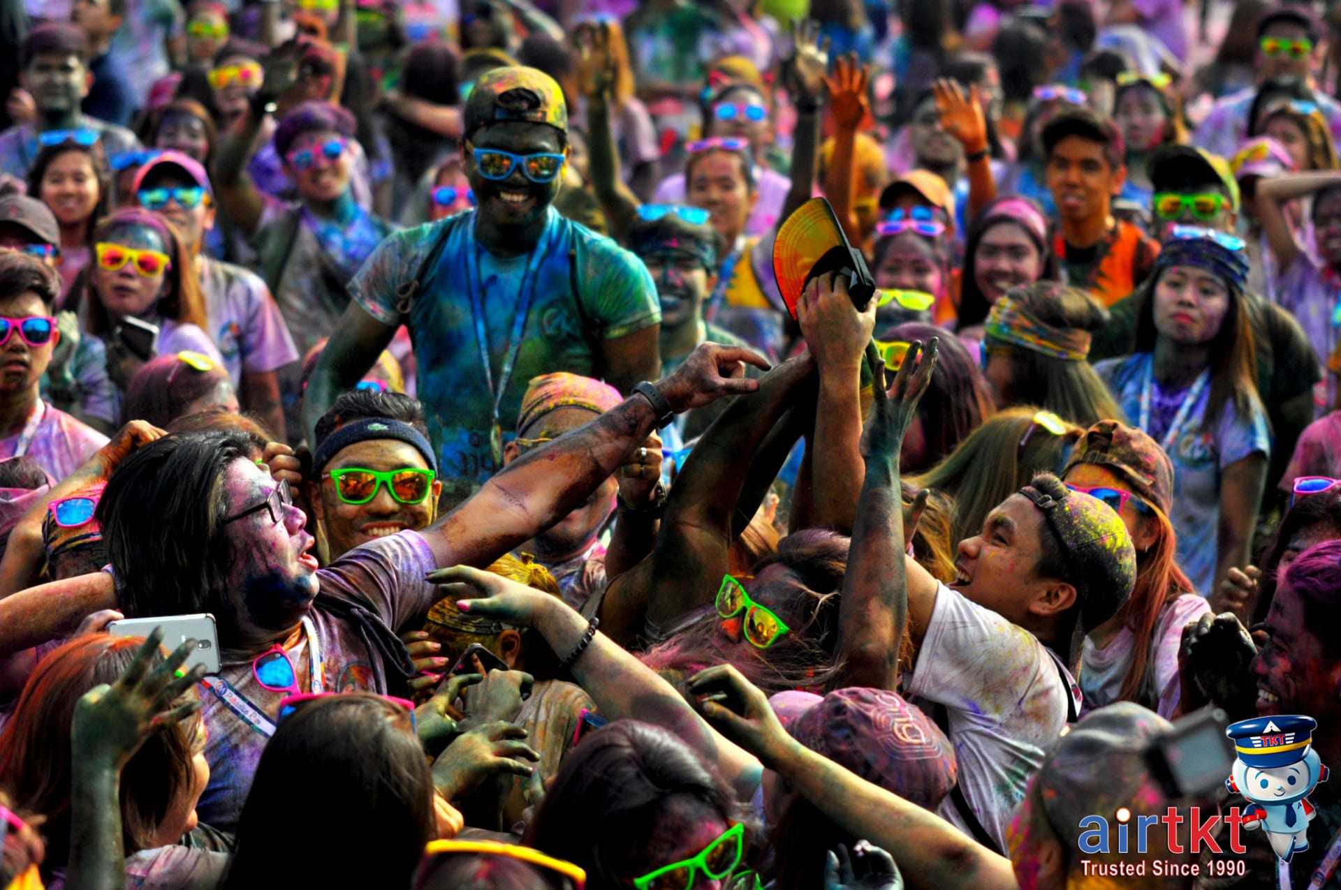 Indian street market decorated with flowers and textiles for Holi festival