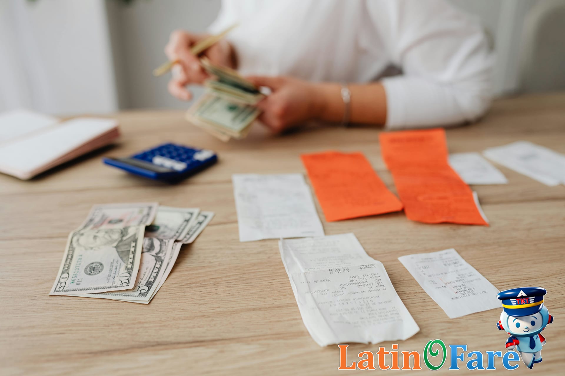 Student budgeting travel expenses for spring break with calculator and notebook.