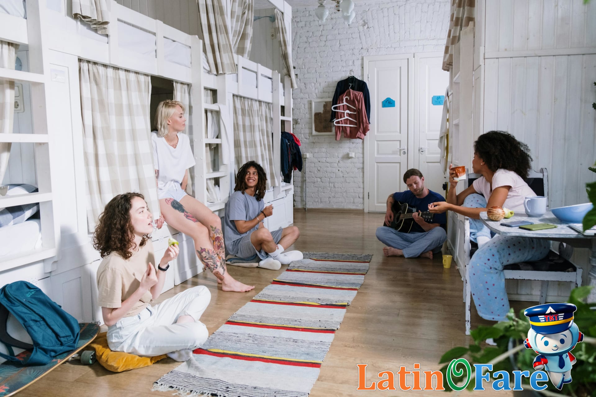 A diverse group of friends enjoying leisure time in a cozy college hostel dorm room.