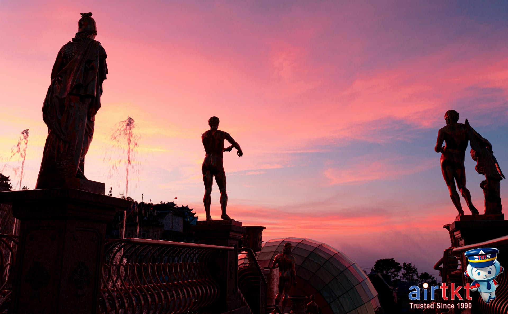 Sunset silhouette of Moai statues on Easter Island colored sky background