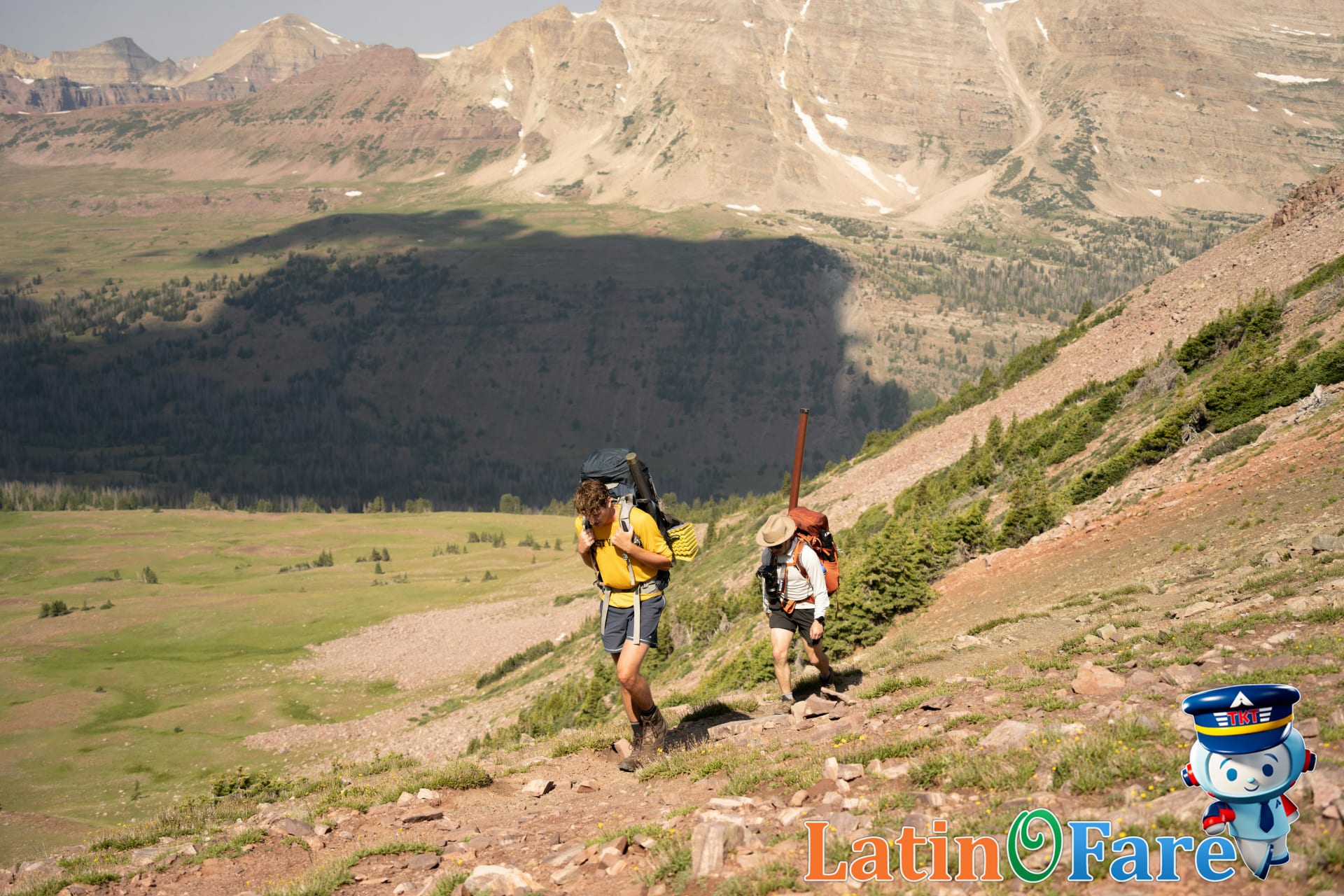 Hikers reaching Machu Picchu along the Gringo Trail with backpacks through mountain scenery