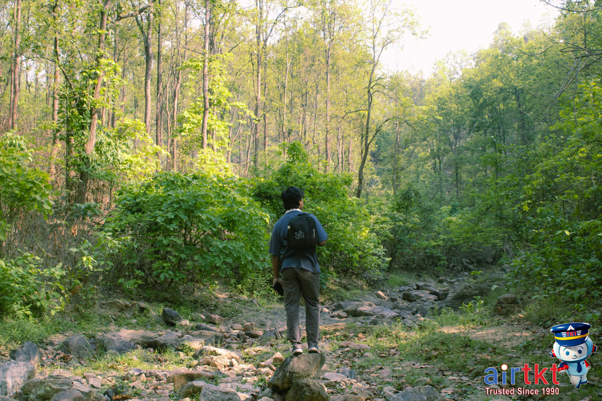 Responsible eco-friendly travel with a traveler following environmental guidelines in a protected landscape