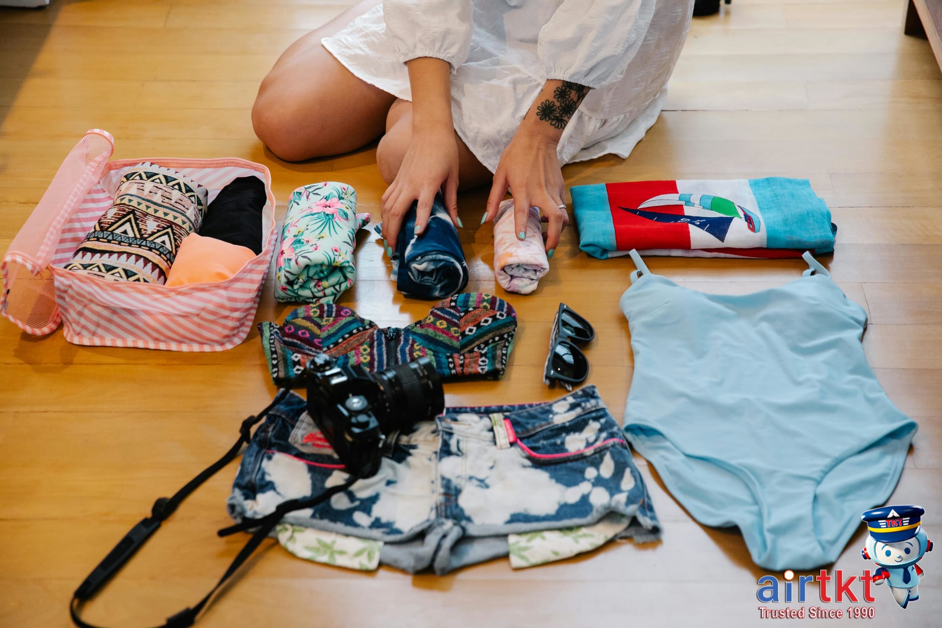 Budget-friendly packing for college spring break travel essentials with backpack and suitcase on bed