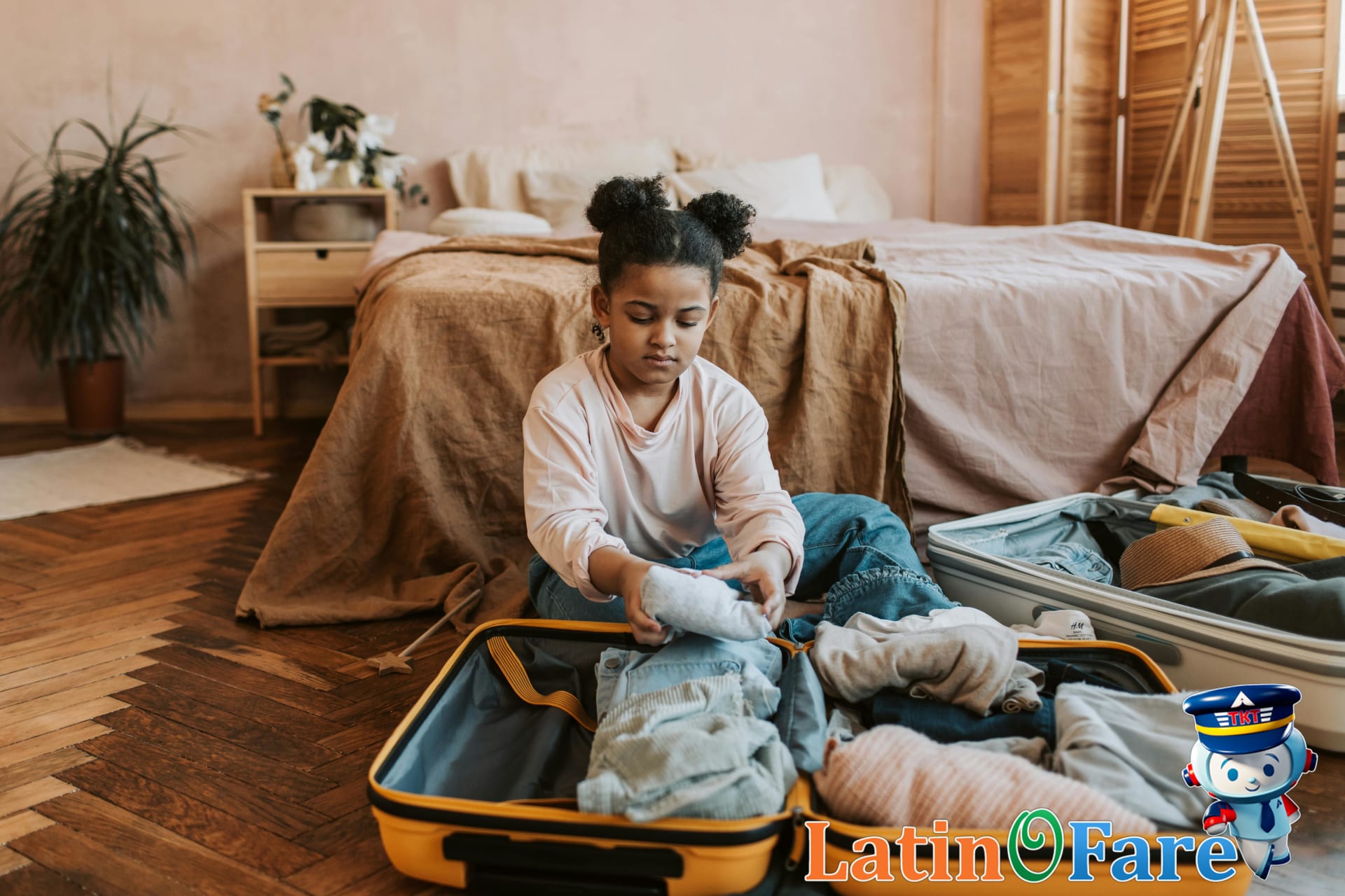 Kids packing favorite travel essentials with parents on bed for their family vacation.