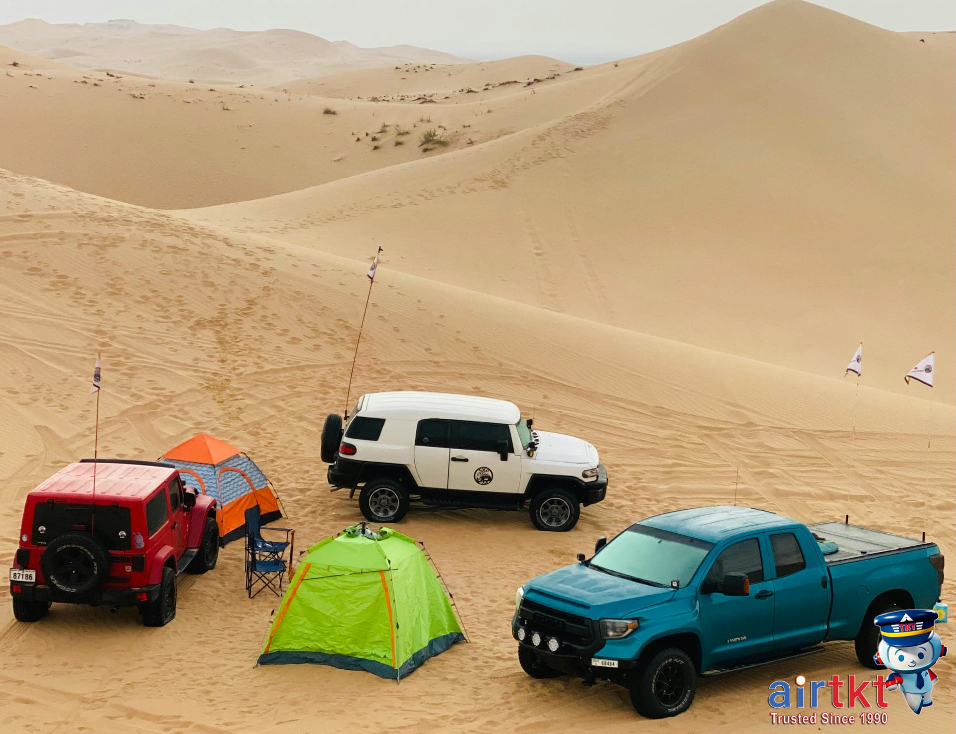 Coachella campers setting up tents in the desert for music festival experience