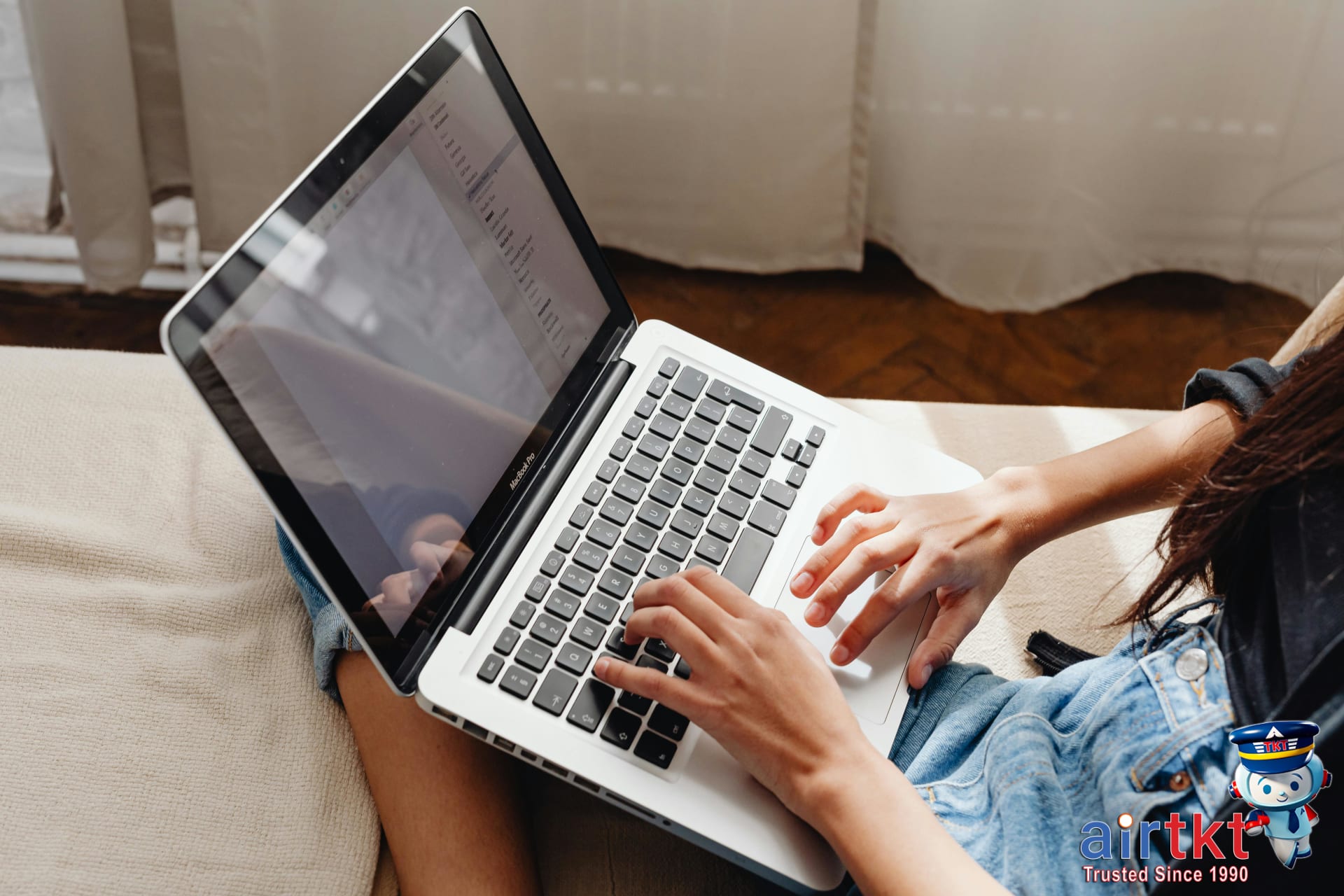 User comparing flight prices using VPN for travel hacks on a laptop at home