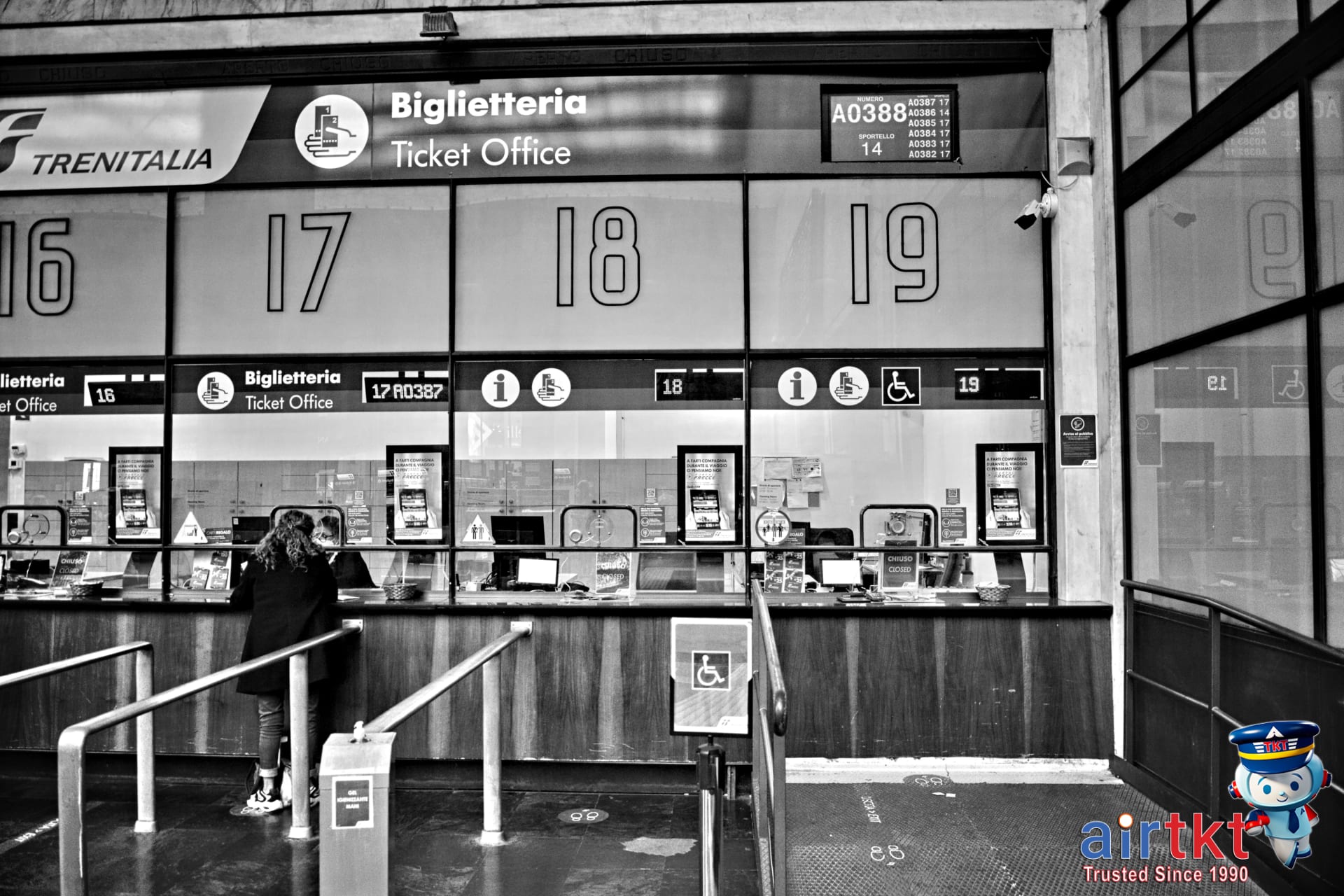 Machu Picchu bus schedule and ticket counters at Aguas Calientes Peru with travelers waiting