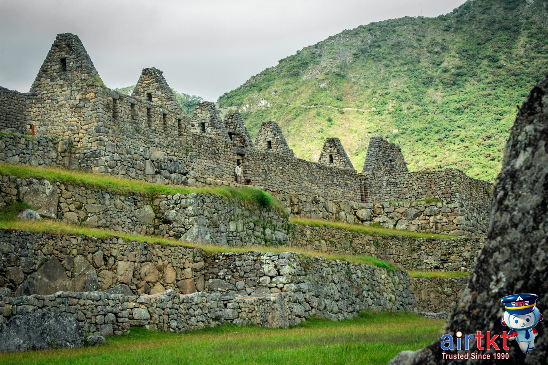 Explore the stone terraces and ancient Inca ruins of Machu Picchu Peru