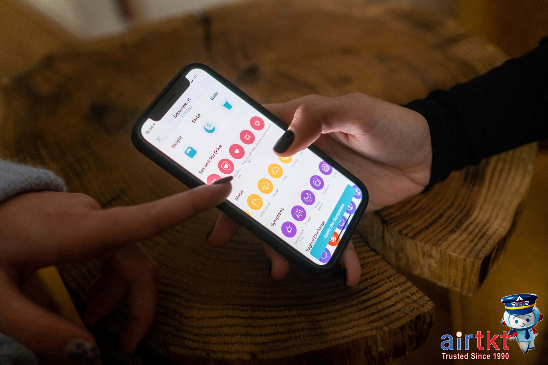 Budgeting travel expenses using a mobile app on a smartphone while traveling