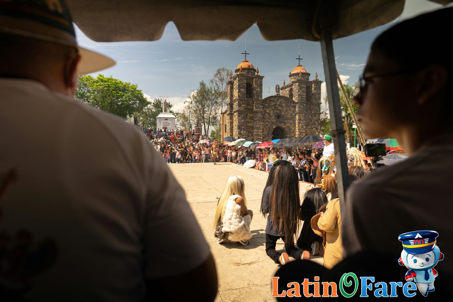 Showing respect at Latin America religious event with attendees dressed for ceremonies