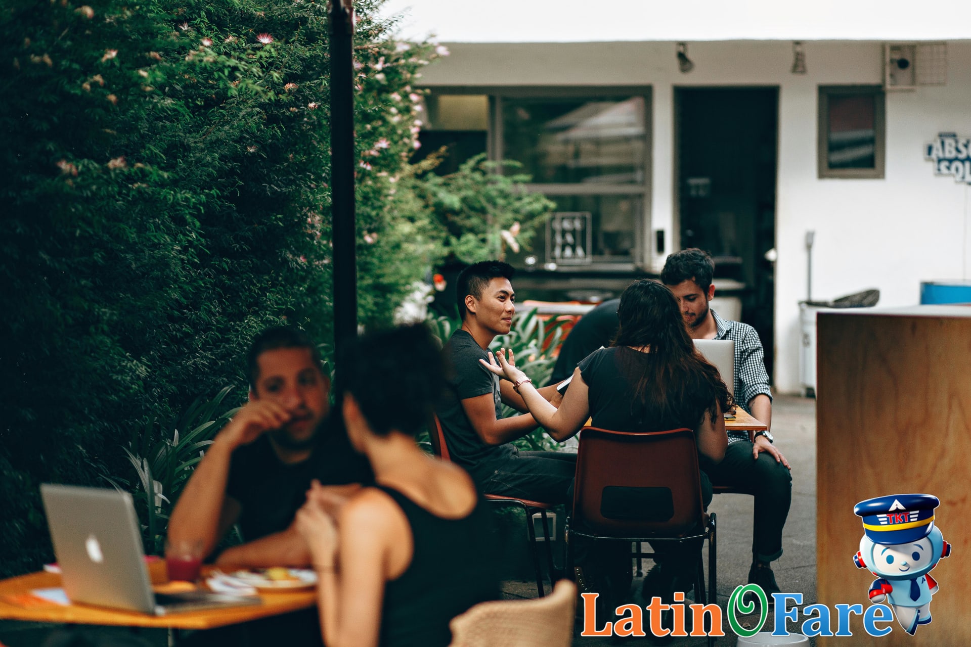 Latin America conversational customs in local café with friends engaged in discussion