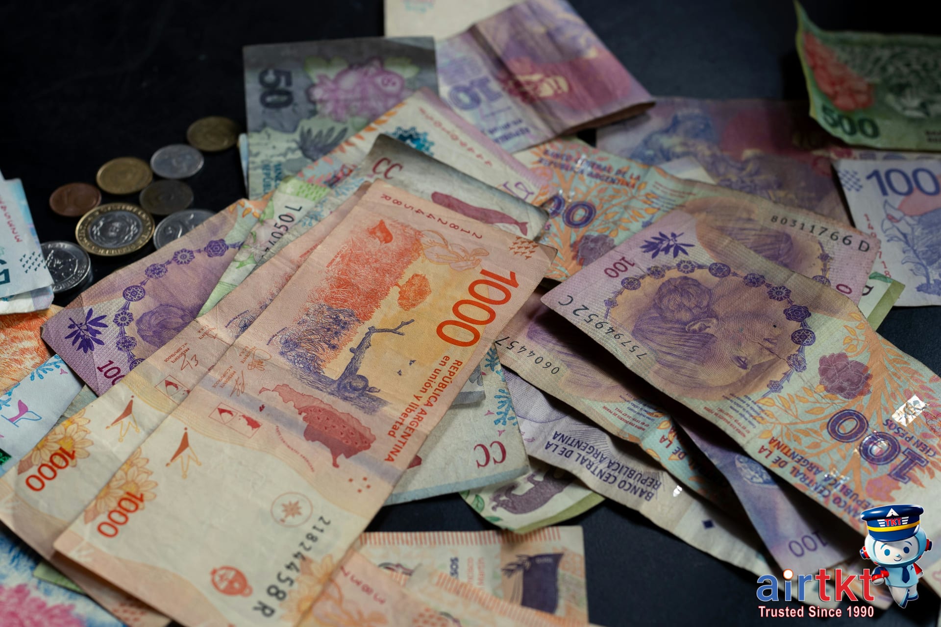 Tipping practices in Latin America with Argentine pesos and a restaurant bill on a wood table