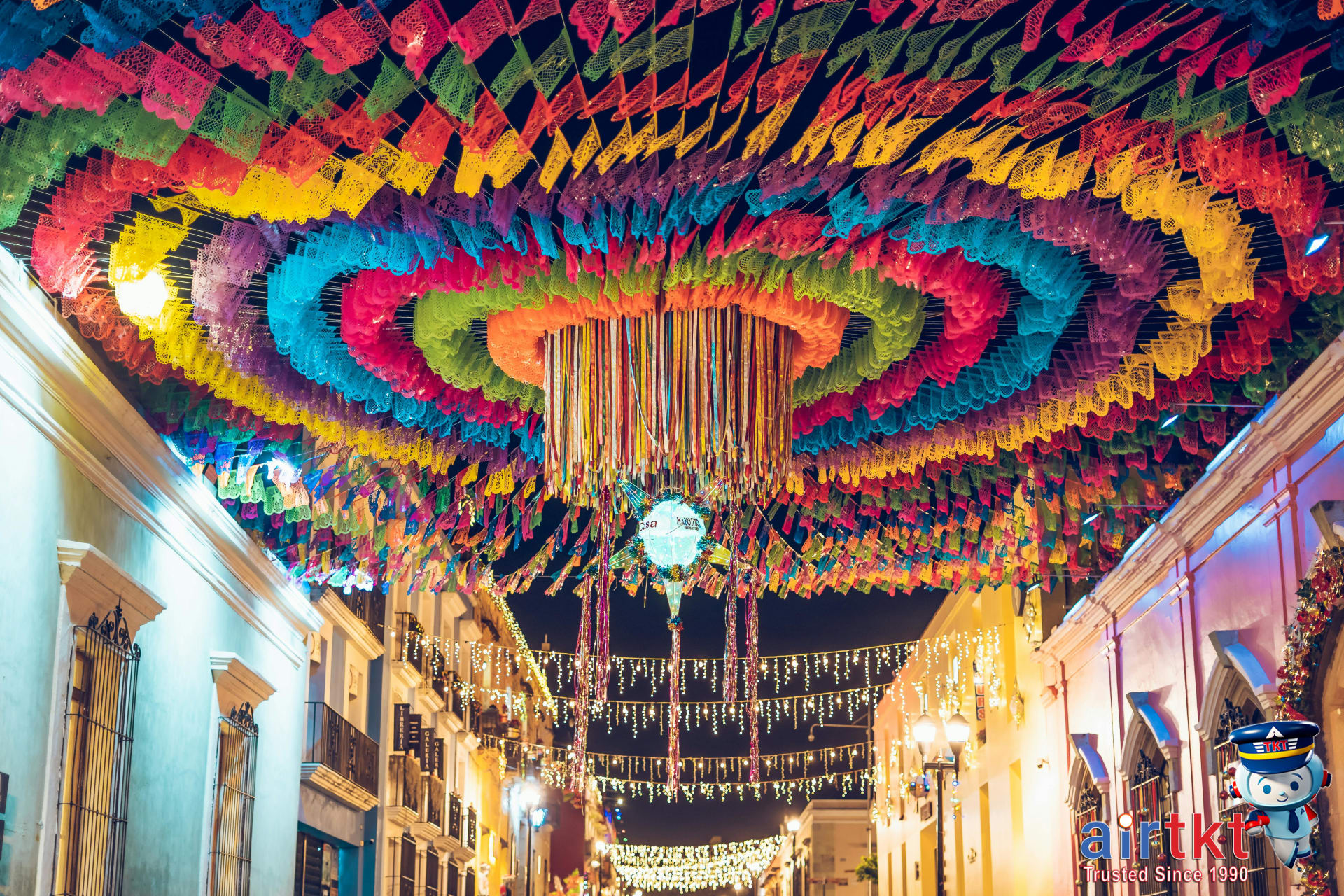 Colorful street decorations during a vibrant festival night in Oaxaca Mexico