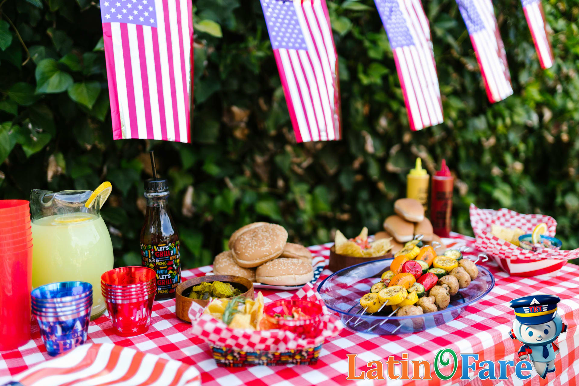 Festive July 4th picnic featuring patriotic American flags, travel snacks, and celebration drinks.