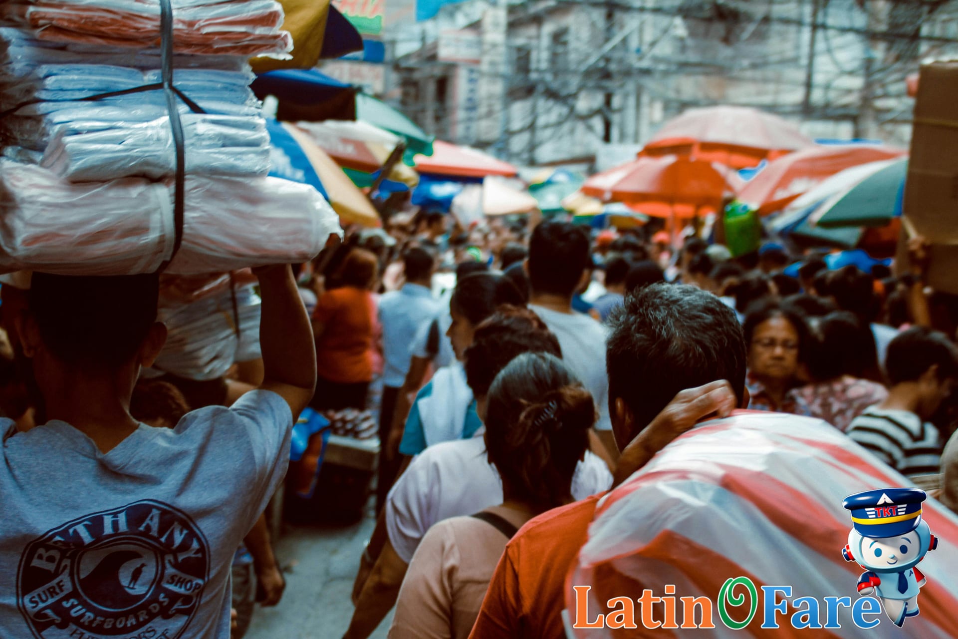 Budget travelers exploring a lively market in the Philippines during Araw ng Kalayaan.