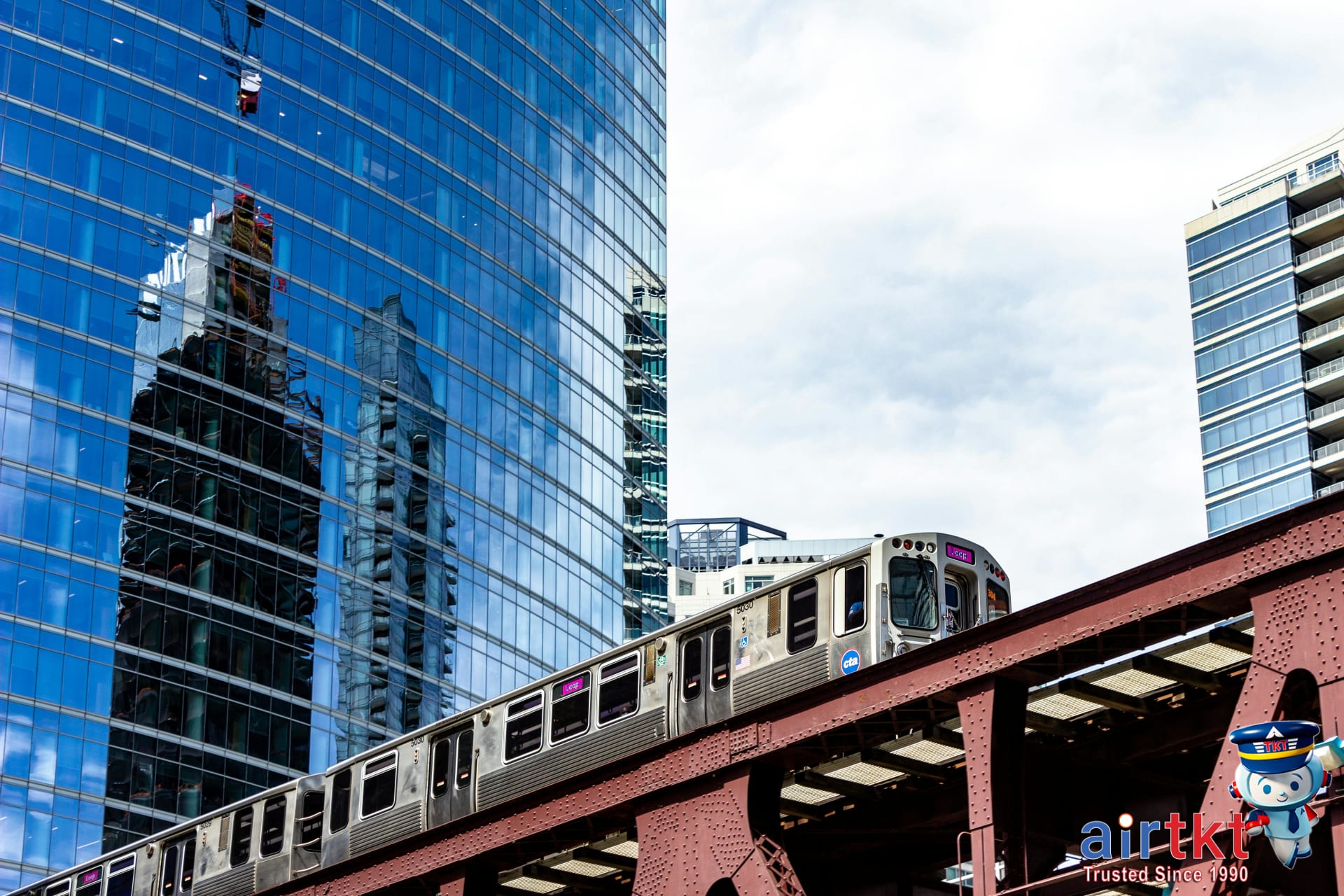 Crowded Chicago L train platform with commuters waiting for different L train lines